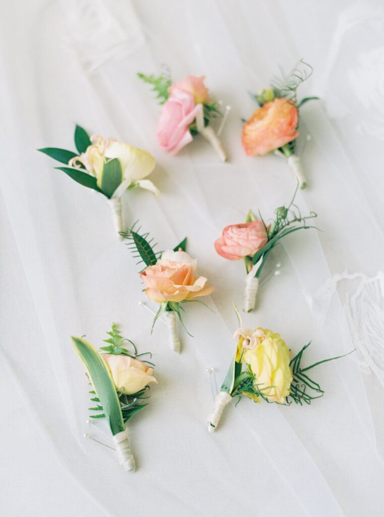 Soft pastel colored boutonnieres. 