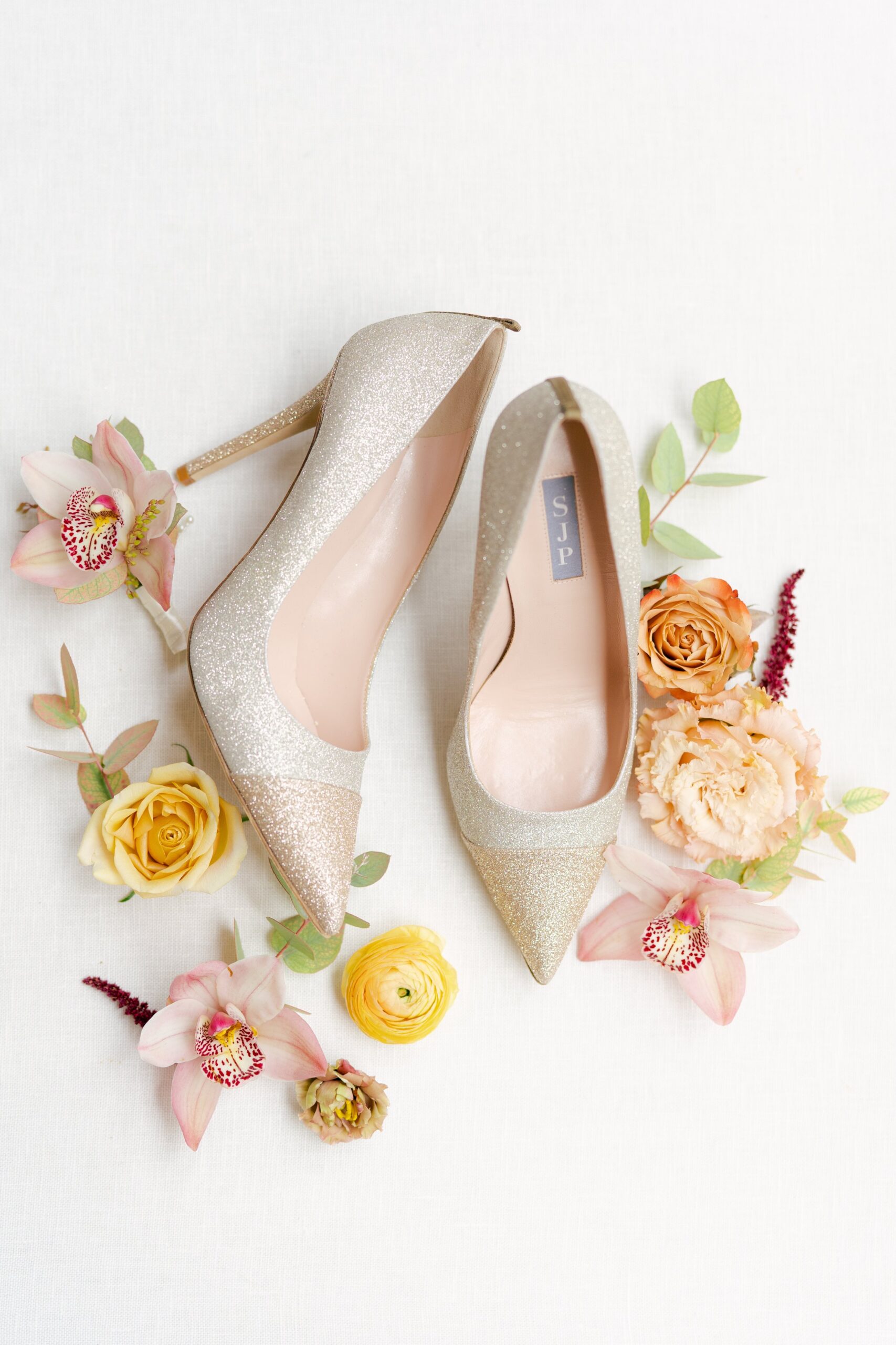 glittery wedding day heels with fall themed flowers