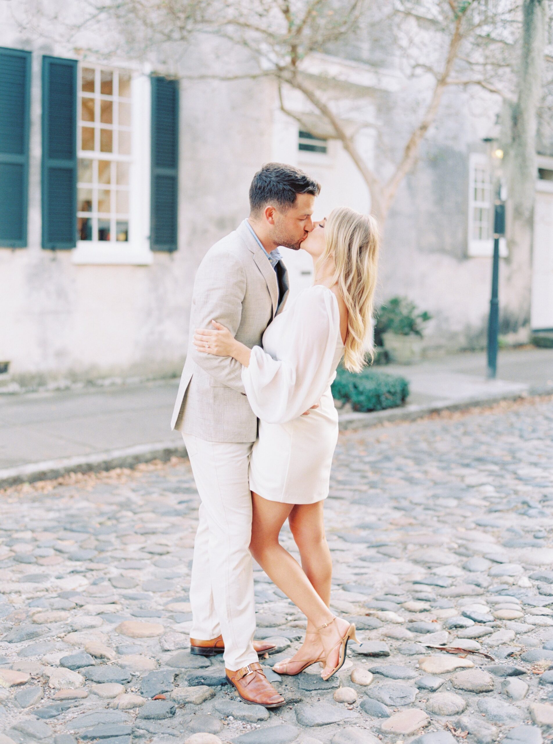 elegant kiss on cobblestone