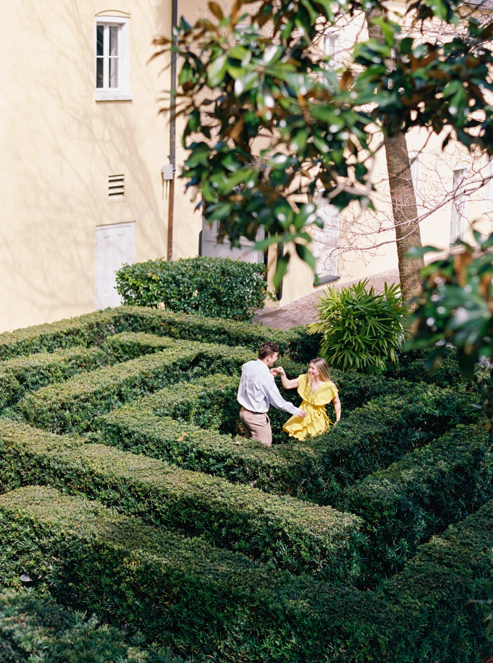 couple twirling in a maze