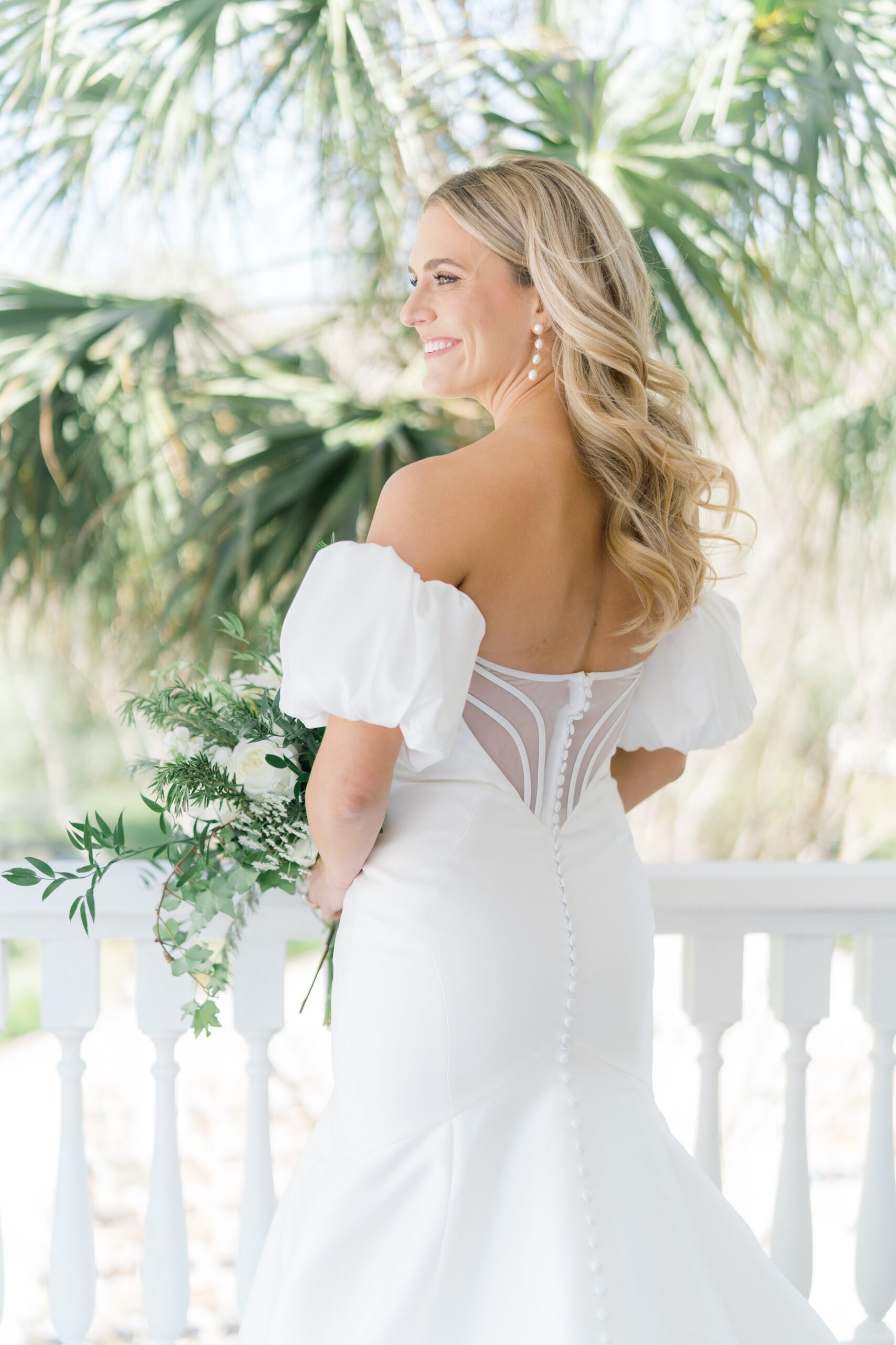 Statement sleeves and back of dress. Classic Charleston bride.  Palm trees at Charleston spring wedding. old wide awake.