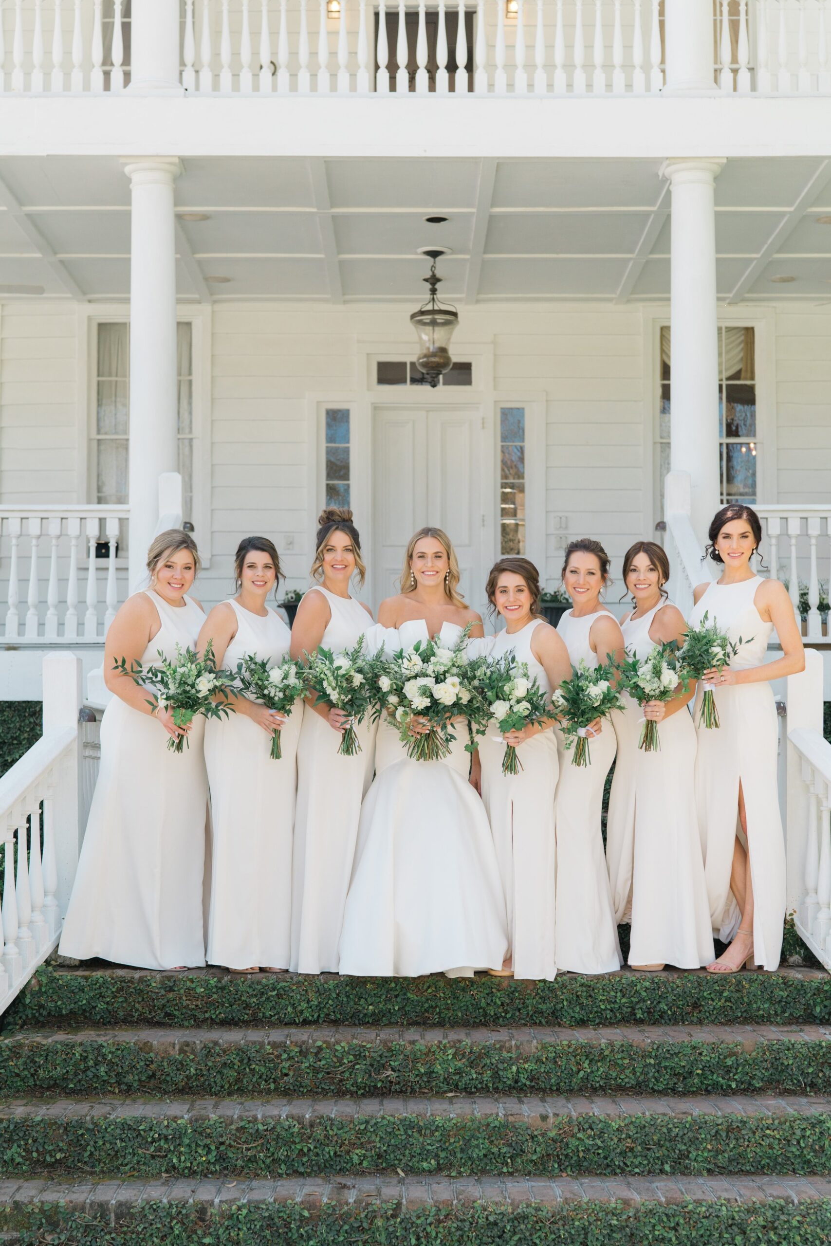 East Coast Outdoor Destination Wedding Photographer. White Bridesmaids dresses. Old Wide Awake greenery ivy steps. Charleston spring wedding.