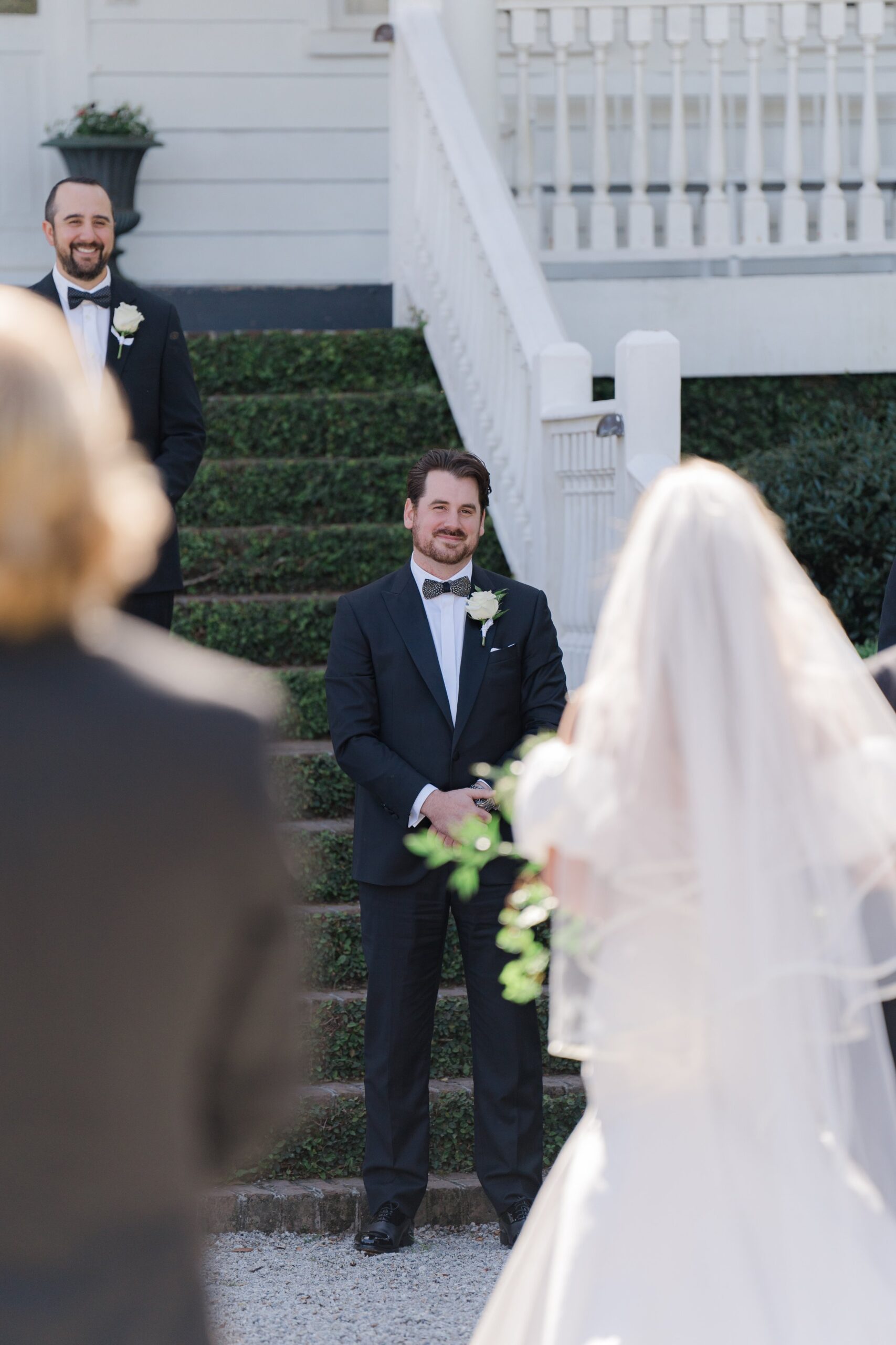 Groom waiting for bride at top of aisle. East Coast Outdoor Destination Wedding Photographer