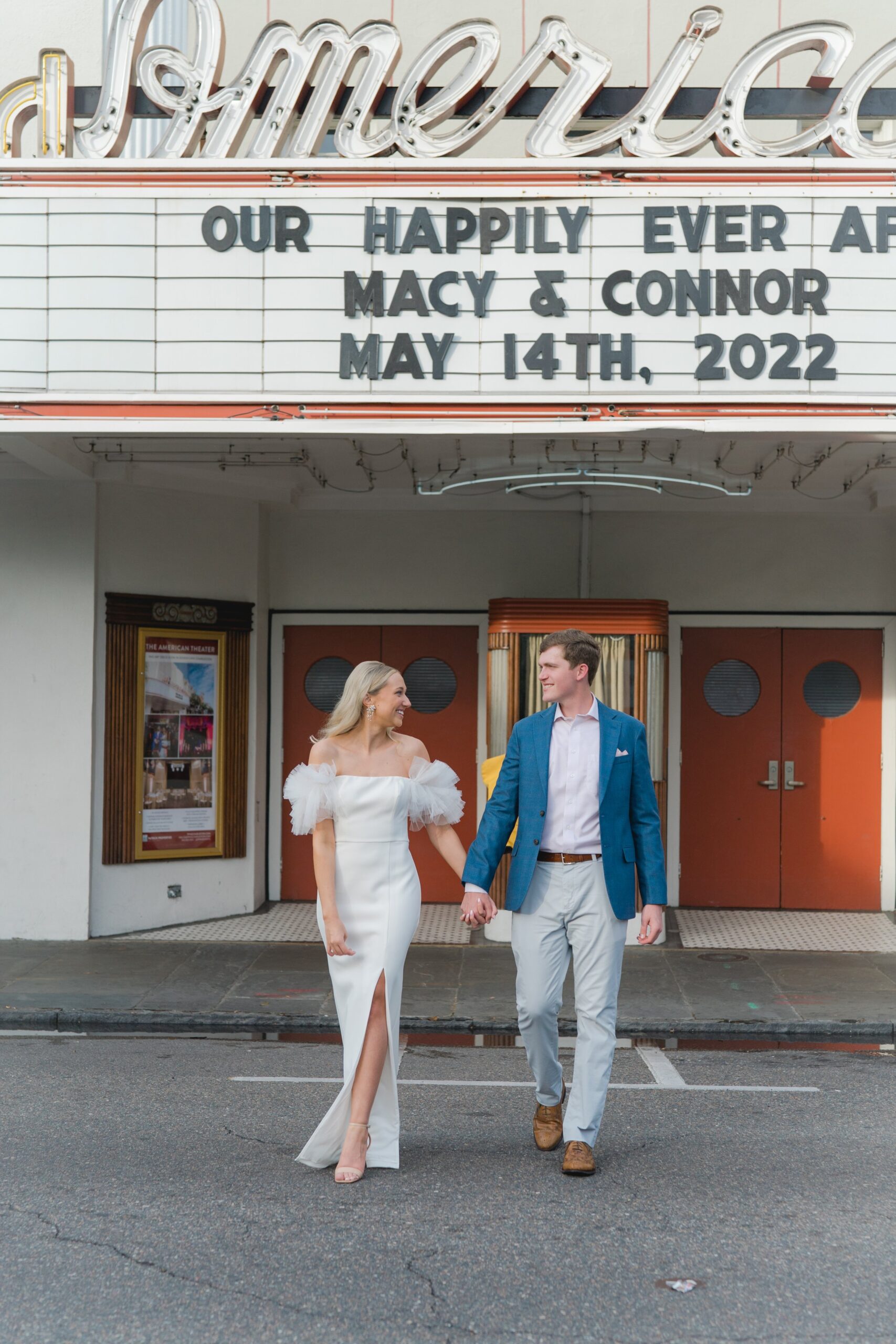 bride and groom crossing king street with custom marquee.