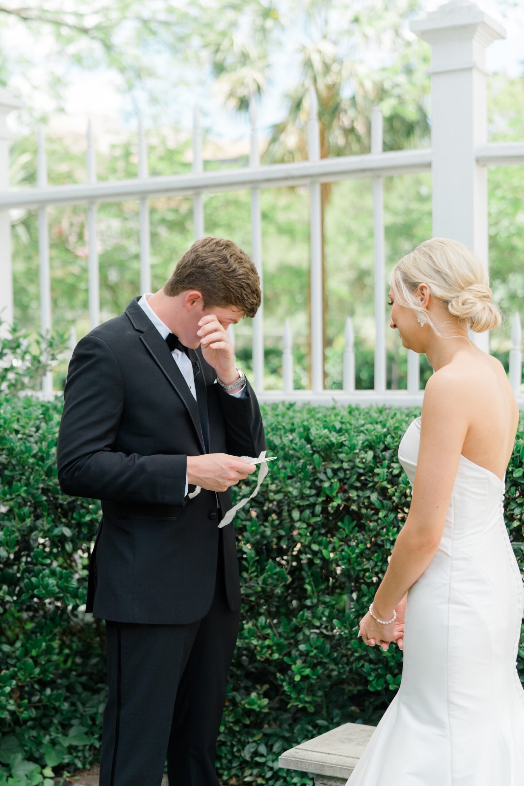 Emotional groom during private vows before spring Charleston wedding.