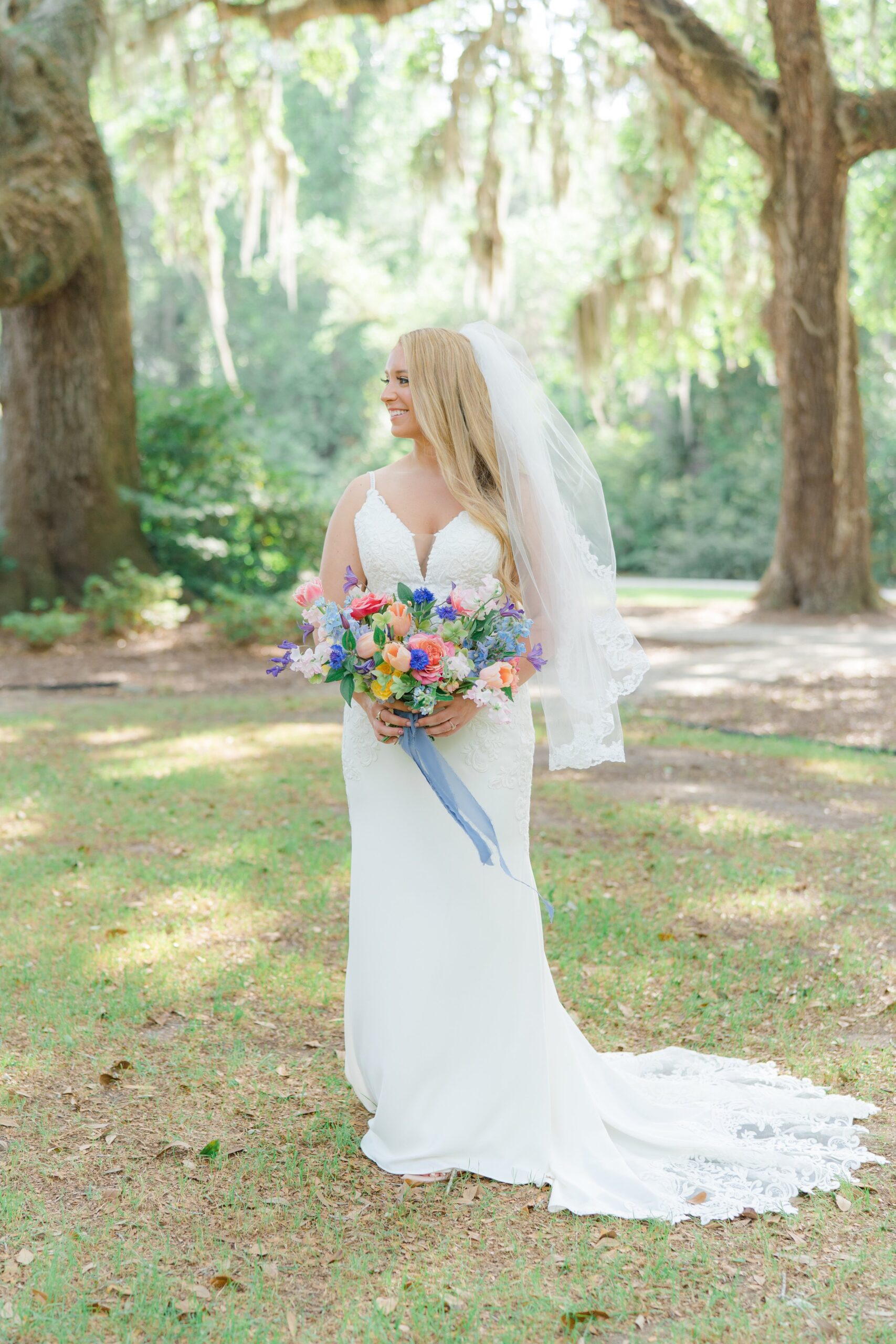classic charleston bride with fun pop of color flowers