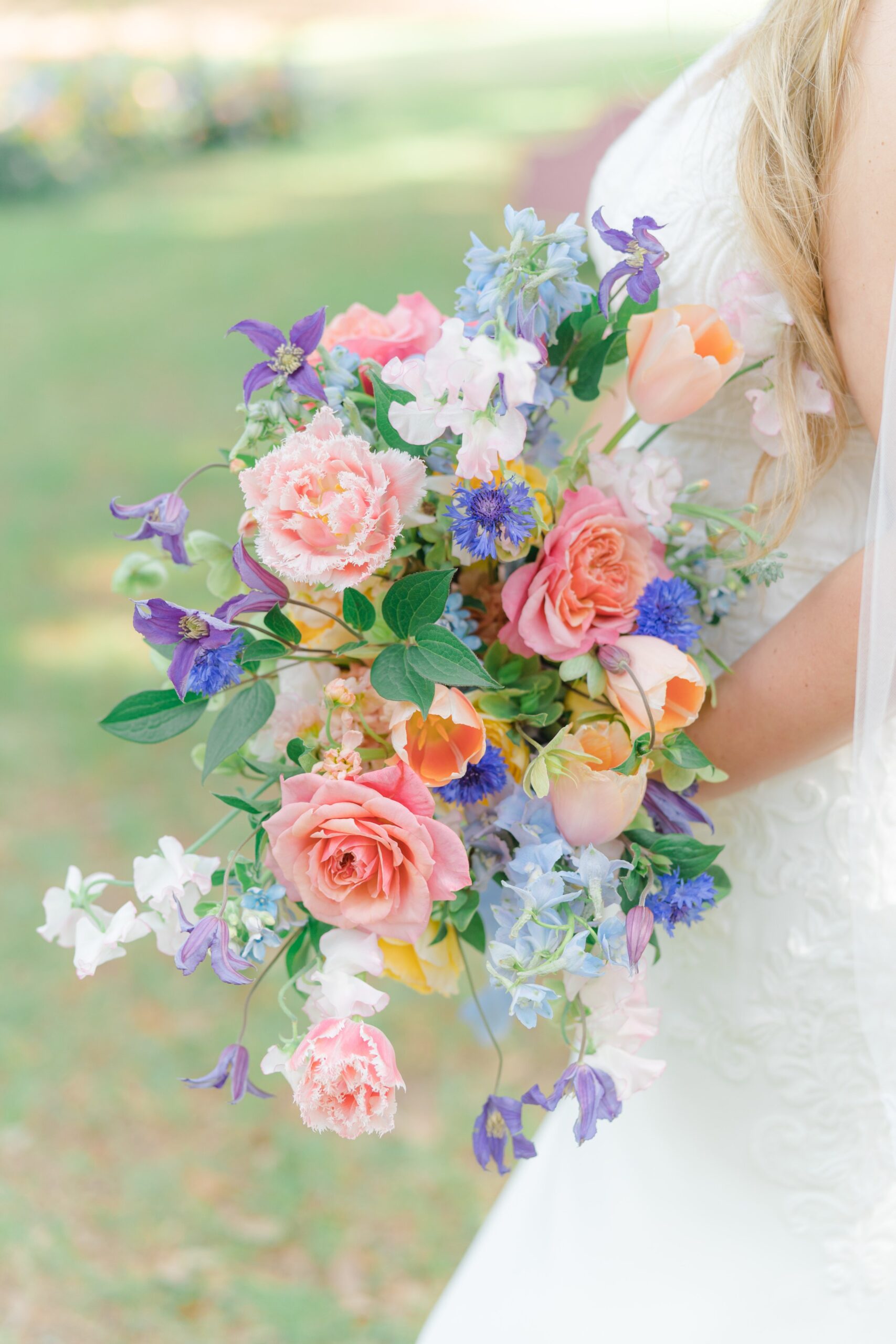bride holding colorful flowers