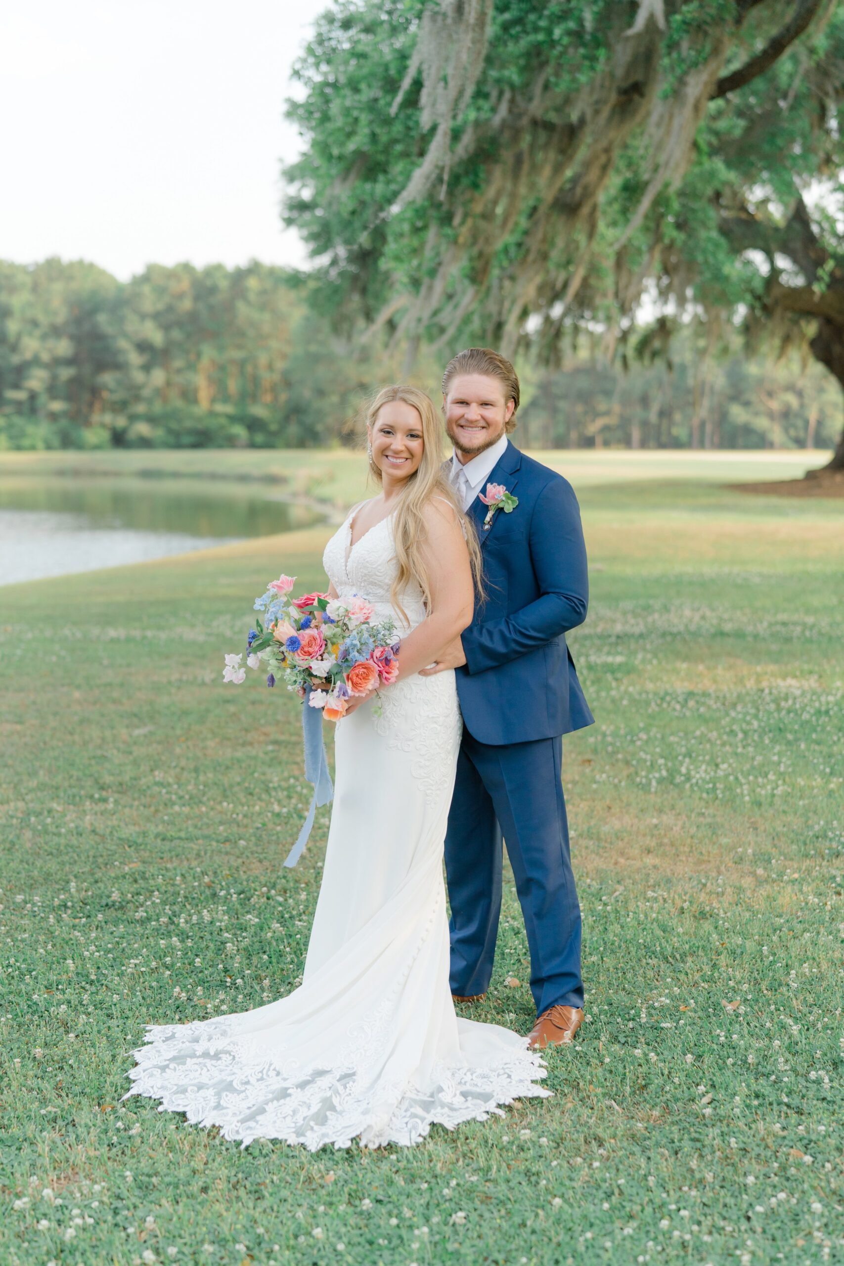 bride and groom with wind blown spanish moss on beautiful spring day
