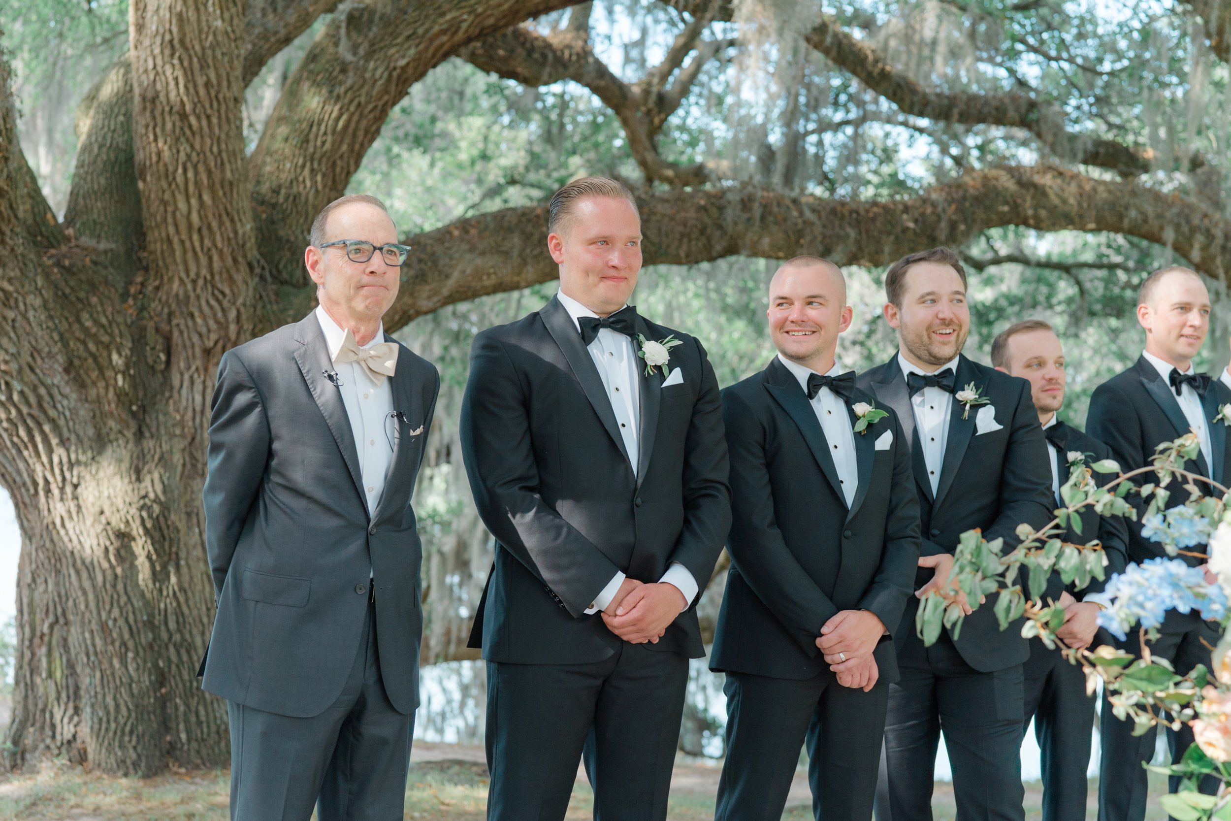 groom and groomsmen wait for bride at wedding ceremony.