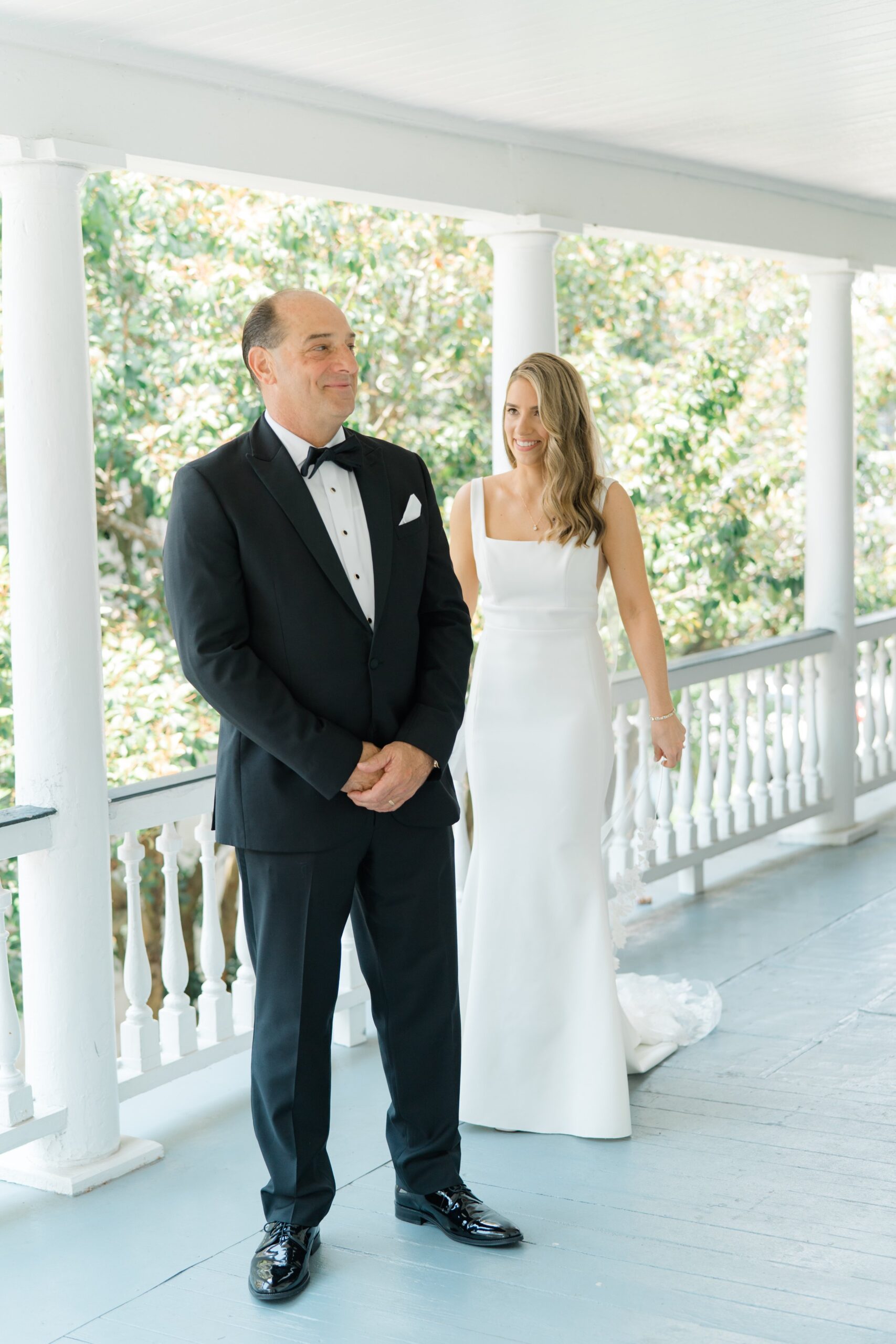 Bride walks up to dad for father daughter first look.