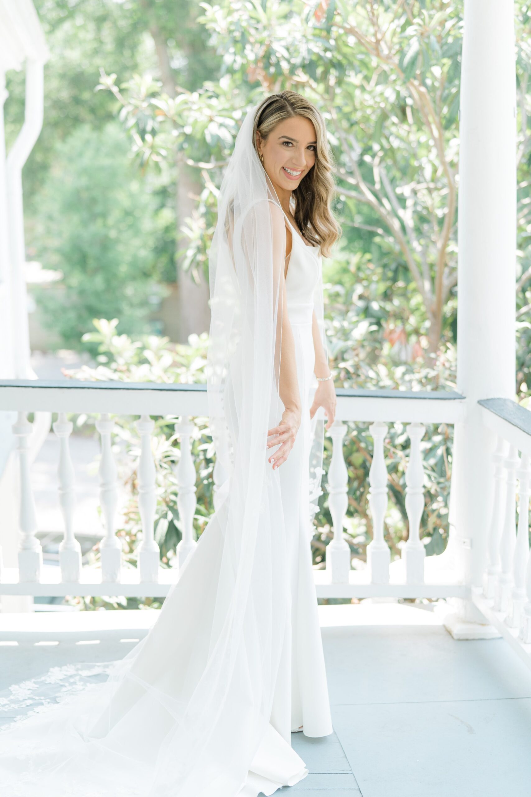 Spring bride on a porch in downtown Charleston