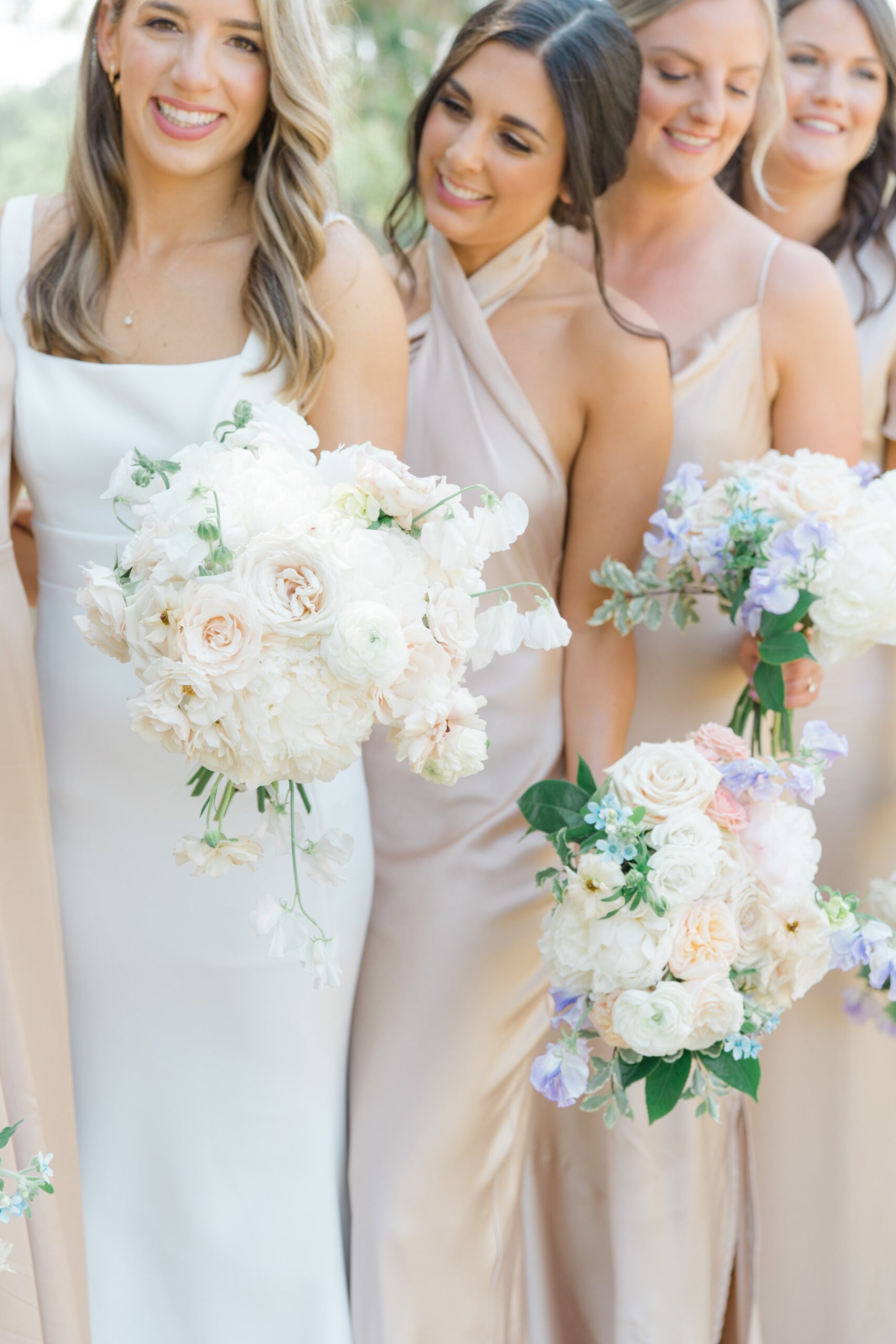 Bride with bridesmaids and flowers.