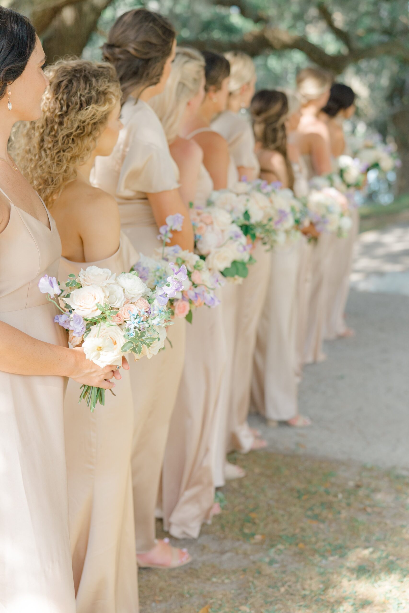 spring bouquets and champagne bridesmaids dresses.