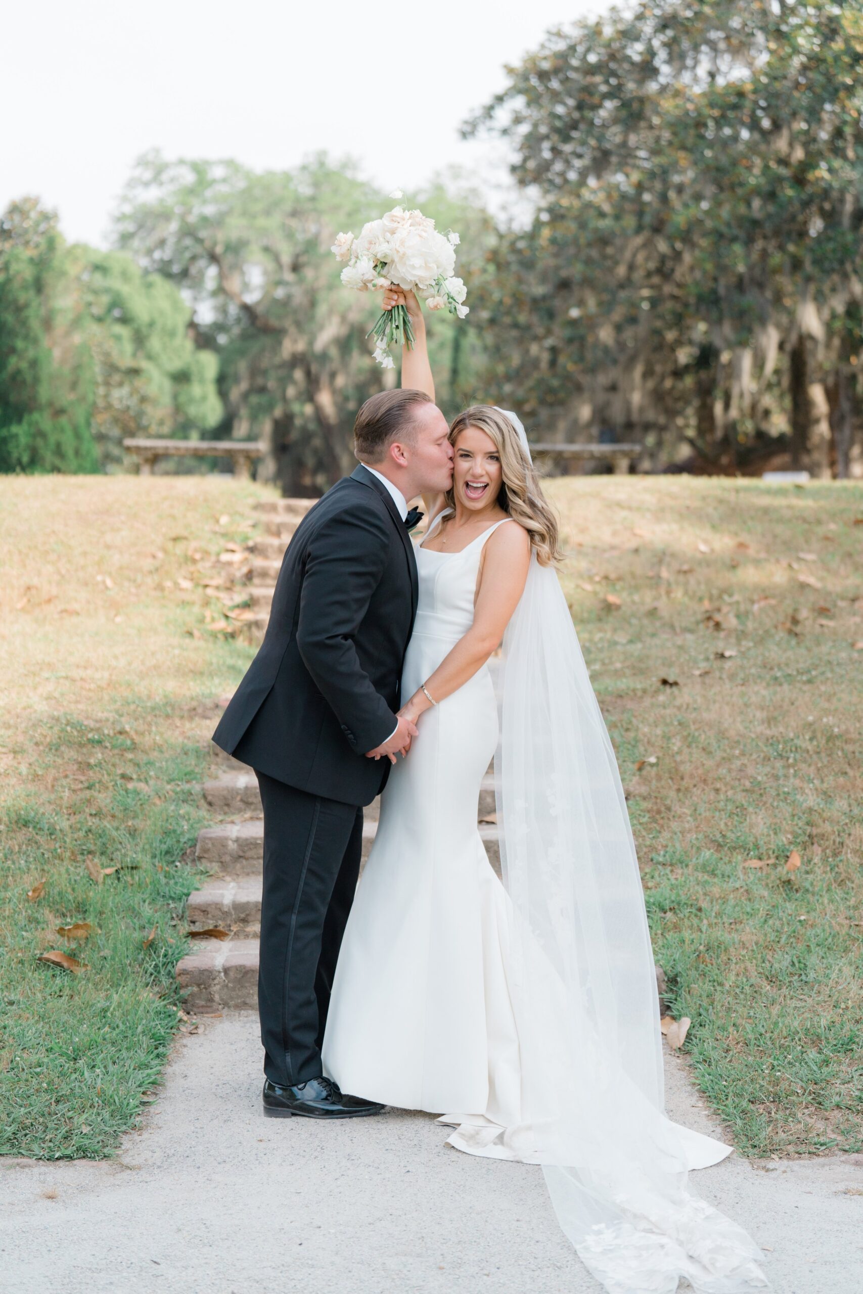Bride celebrates with groom at Middleton Place