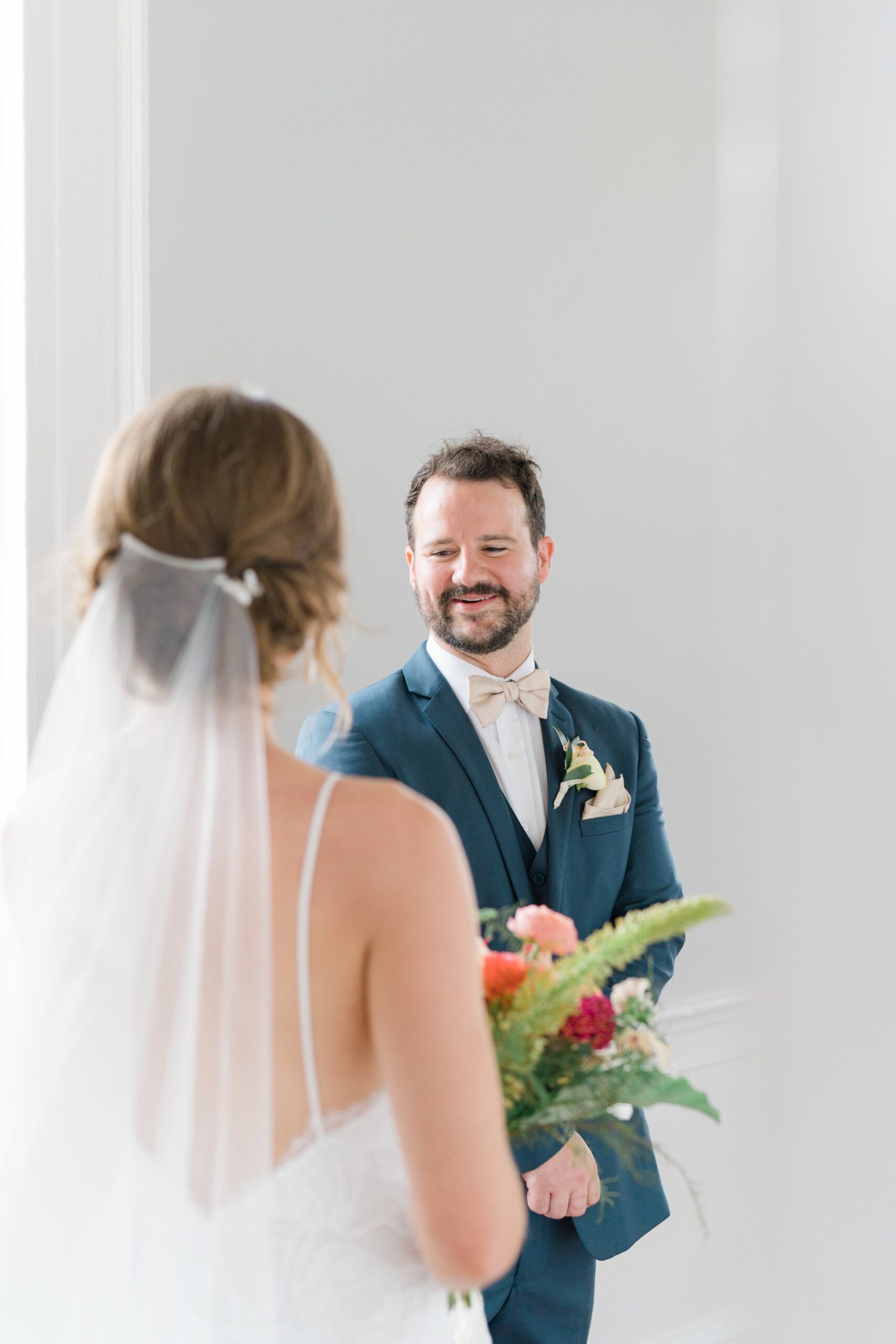 Groom sees bride for the first time at Charleston wedding. Wedding day bride and groom first look.