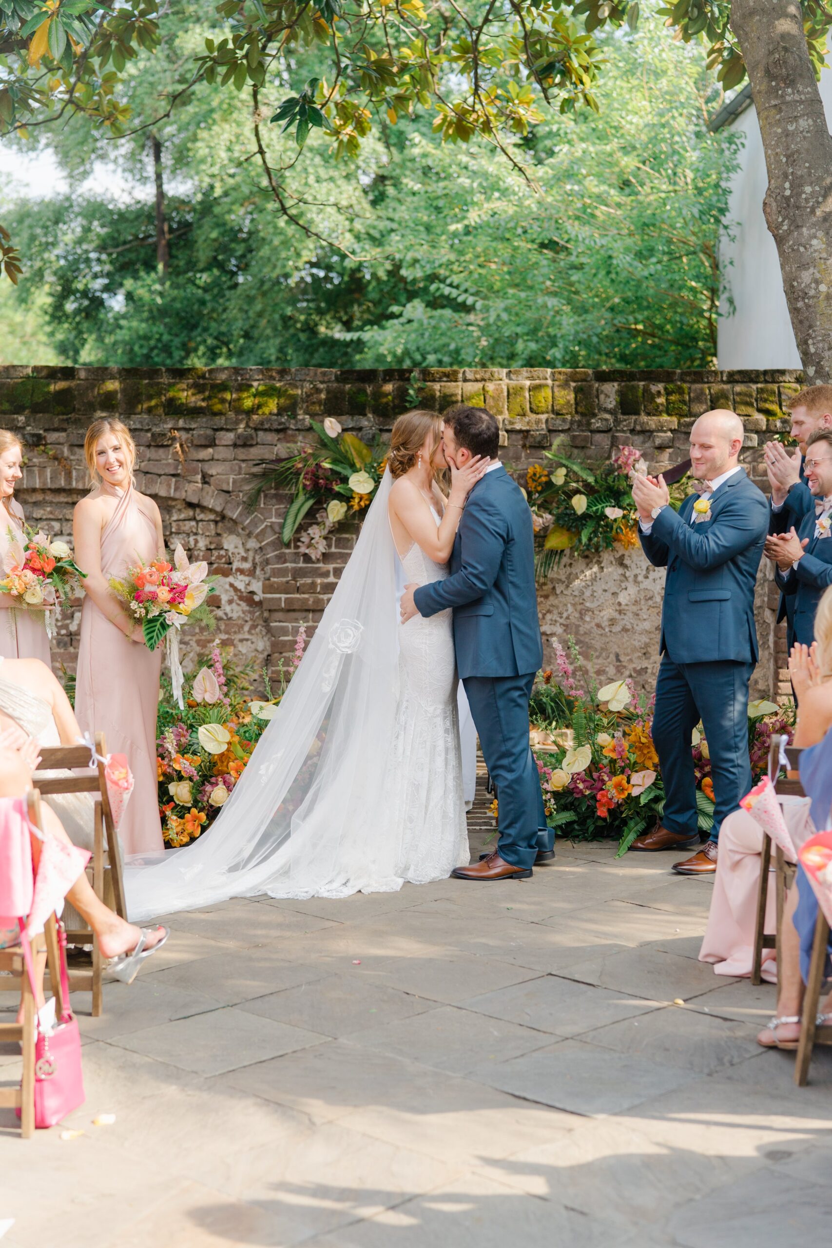 Gadsden House first kiss. Tropical wedding ceremony flowers.