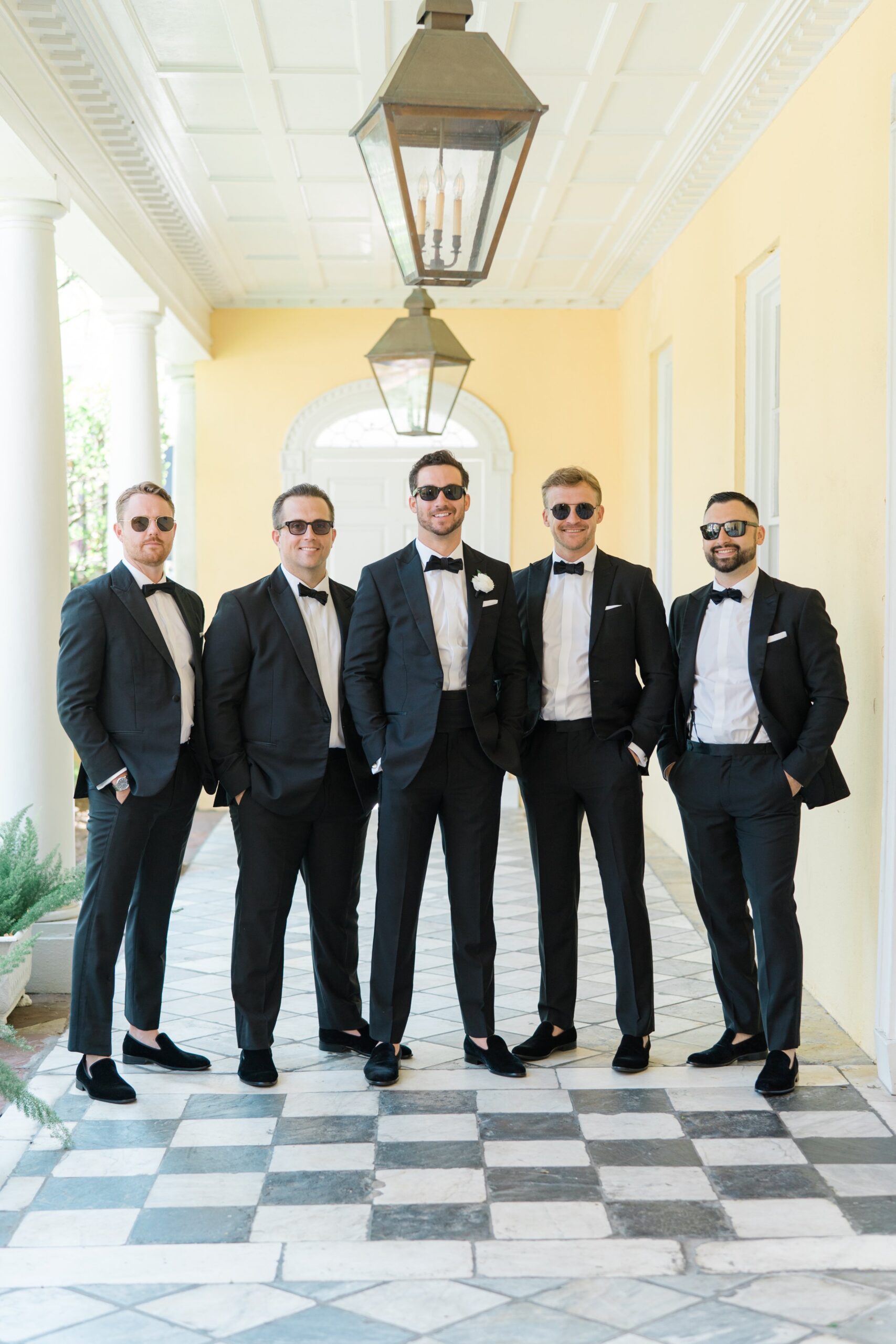 Black tie groom and groomsmen wearing sunglasses. Classy Charleston wedding.