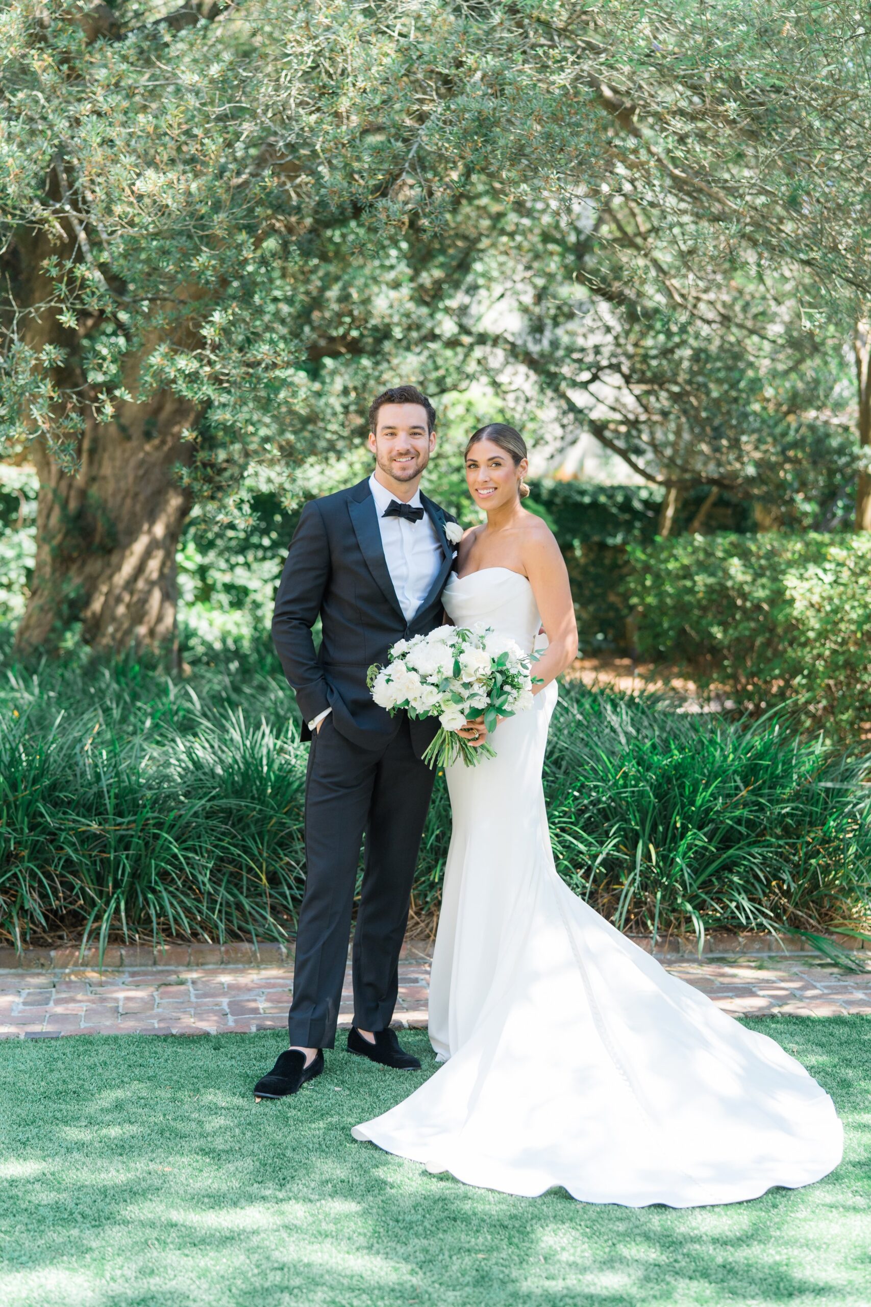 Natural lighting wedding day portraits. Light and airy bride and groom portraits at Charleston wedding venue.