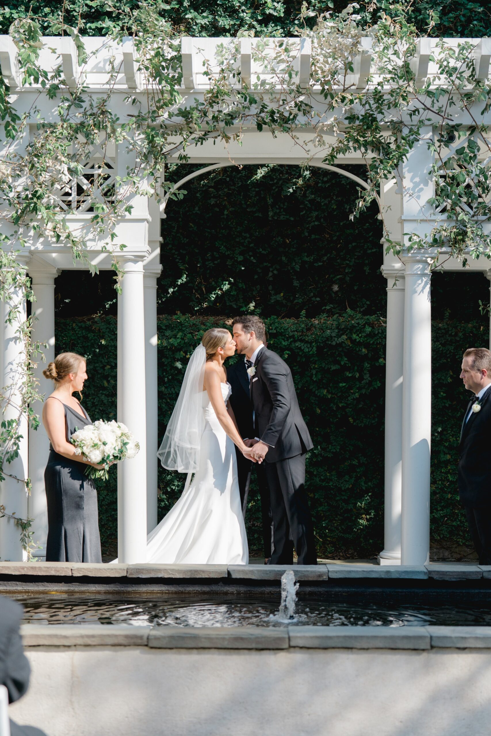 First kiss at William Aiken House spring wedding ceremony.