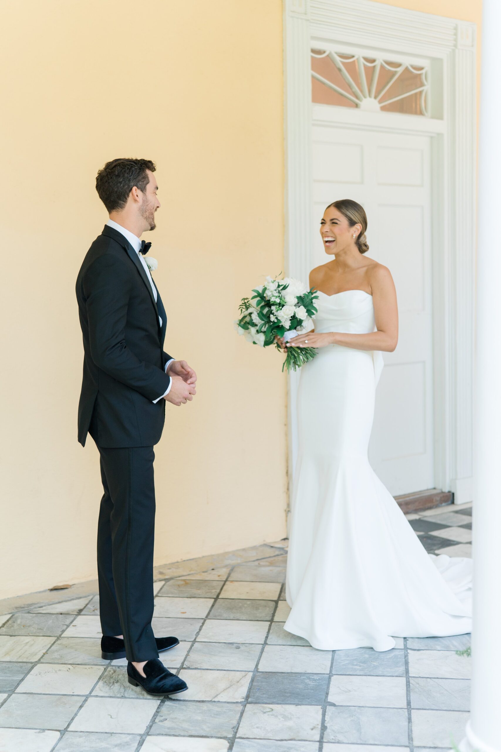 Bride and groom see each other for first time at spring Charleston wedding.