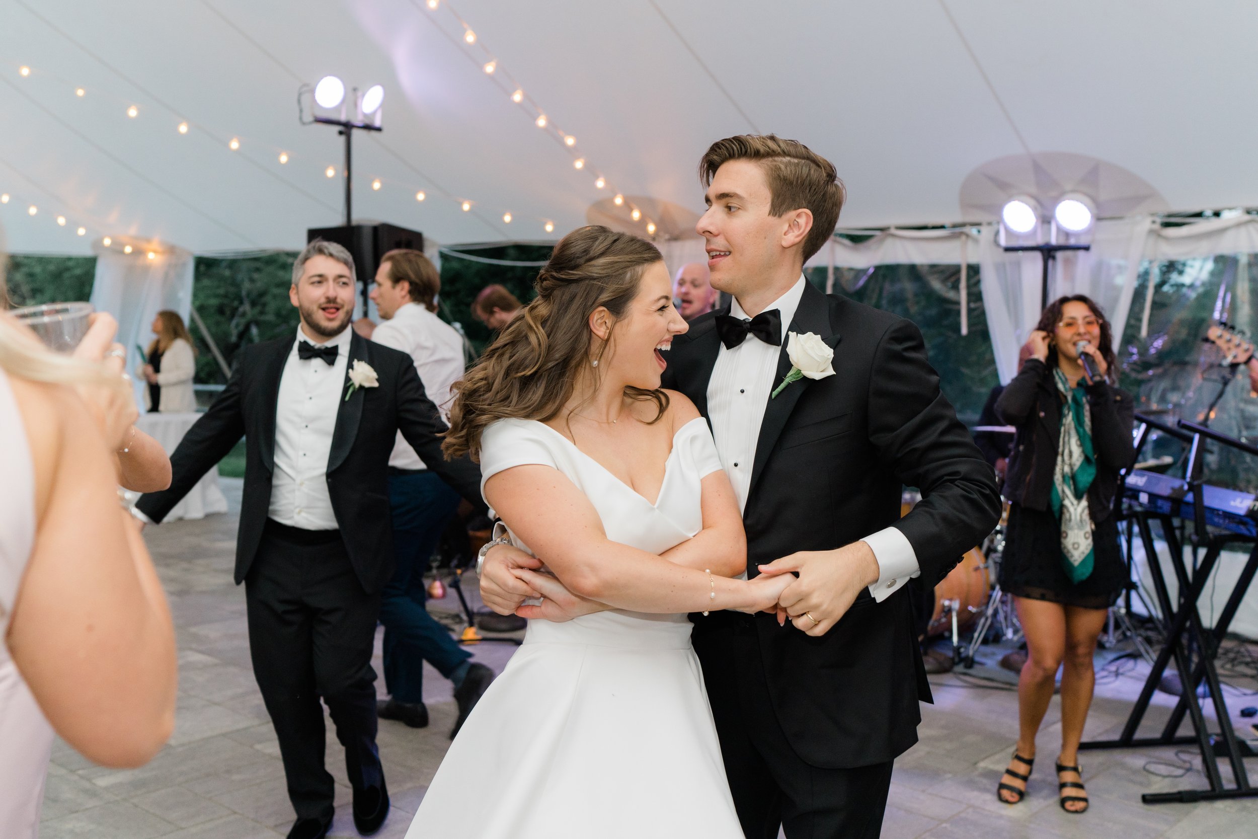 get the party started with bride and groom at outdoor wedding reception in Boston.