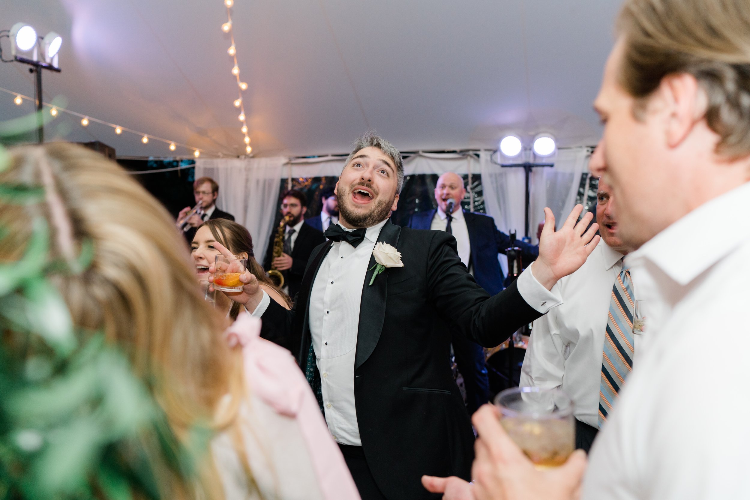 Groomsmen lets loose on the dance floor at Bradley Estate outdoor wedding reception.