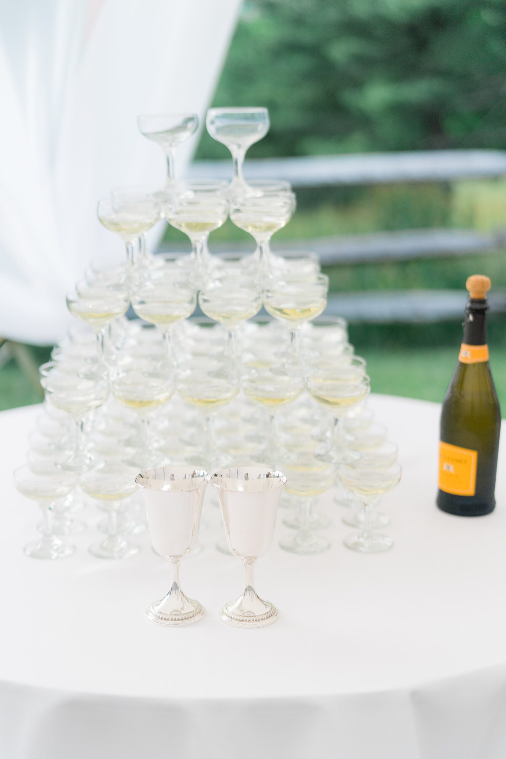 Champagne tower with silver goblets. Boston summer wedding reception
