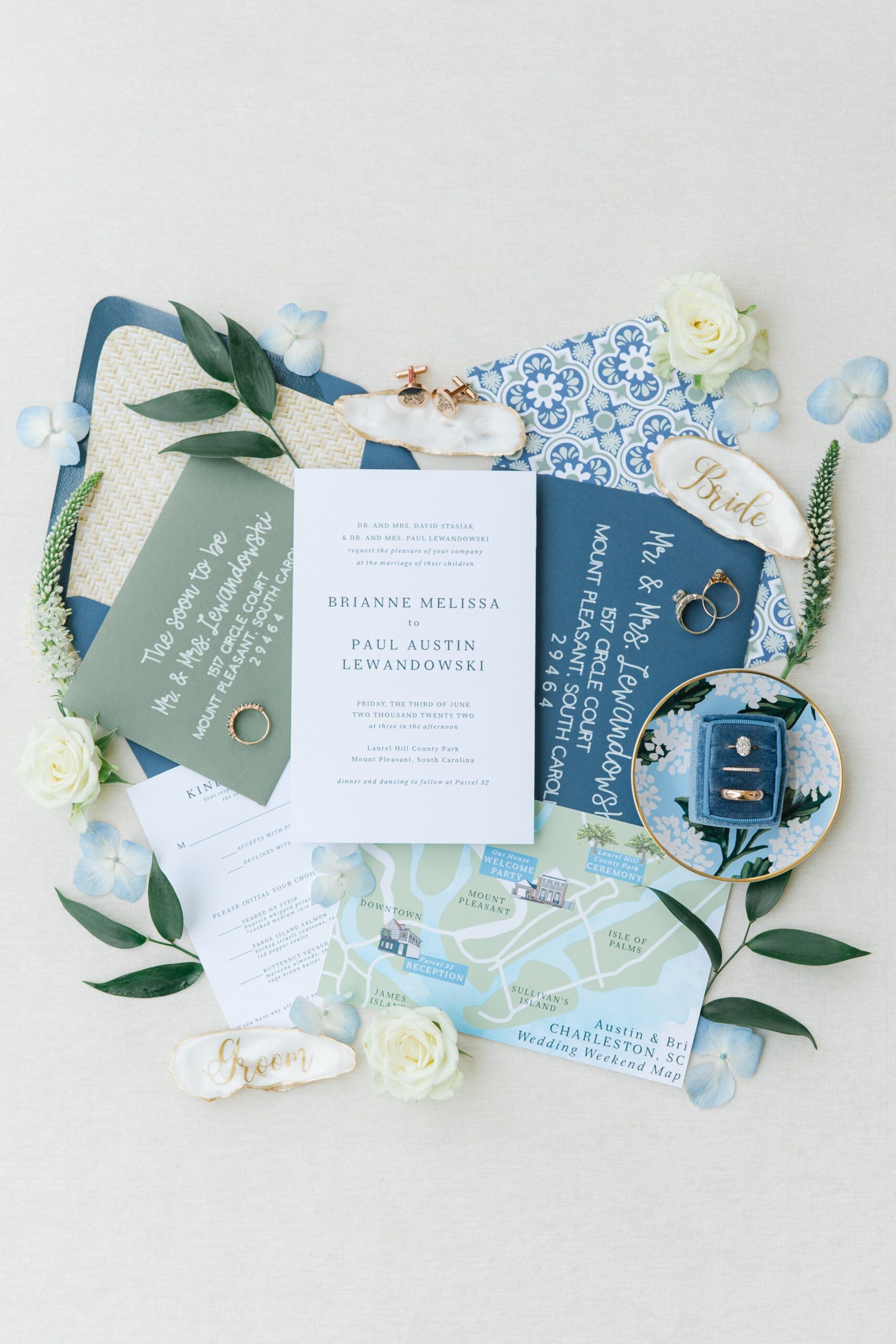 green and blue themed wedding day invitation suite.