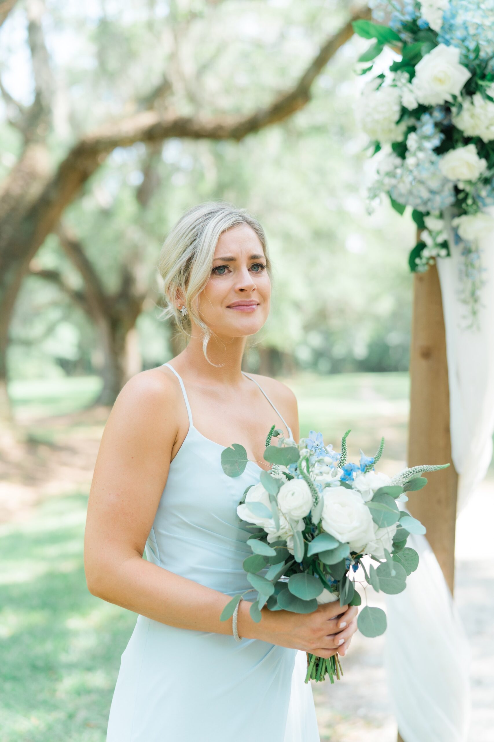 emotional maid of honor at outdoor spring wedding ceremony in charleston.