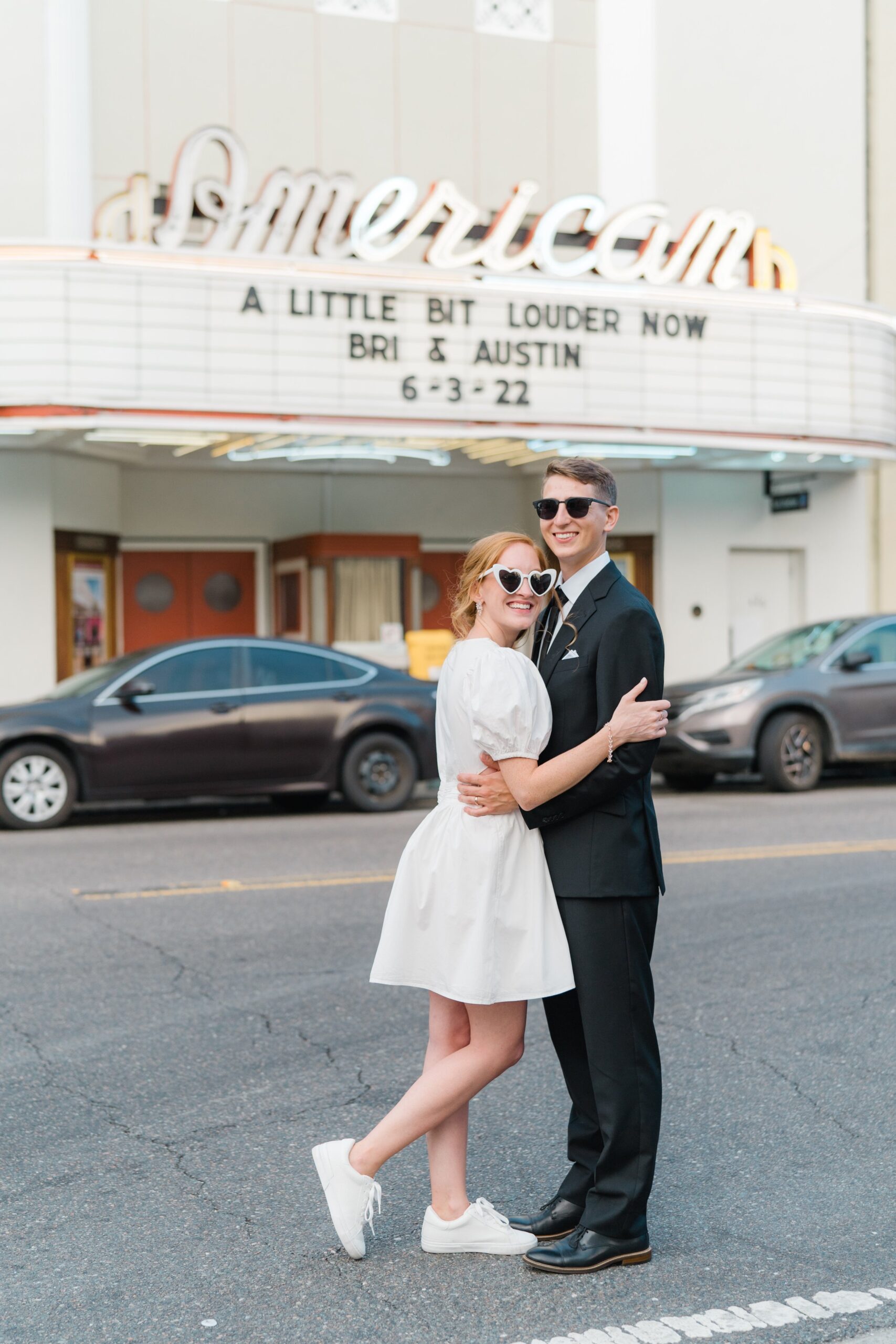 bride changes into cute sweetheart dress. cute wedding photo in downtown Charleston.