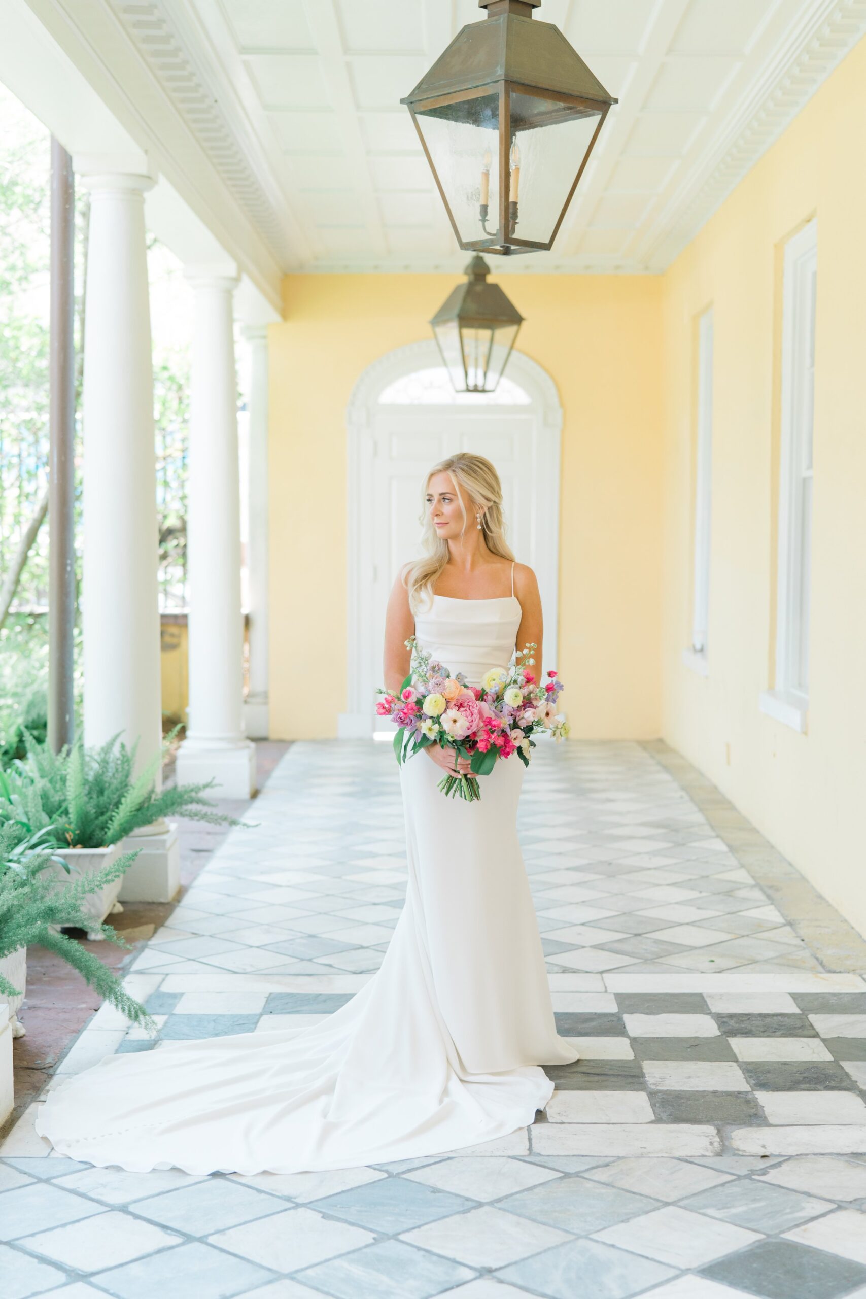 classic bridal portrait at william aiken house on the morning of a spring wedding. bold spring colors for bouquet.