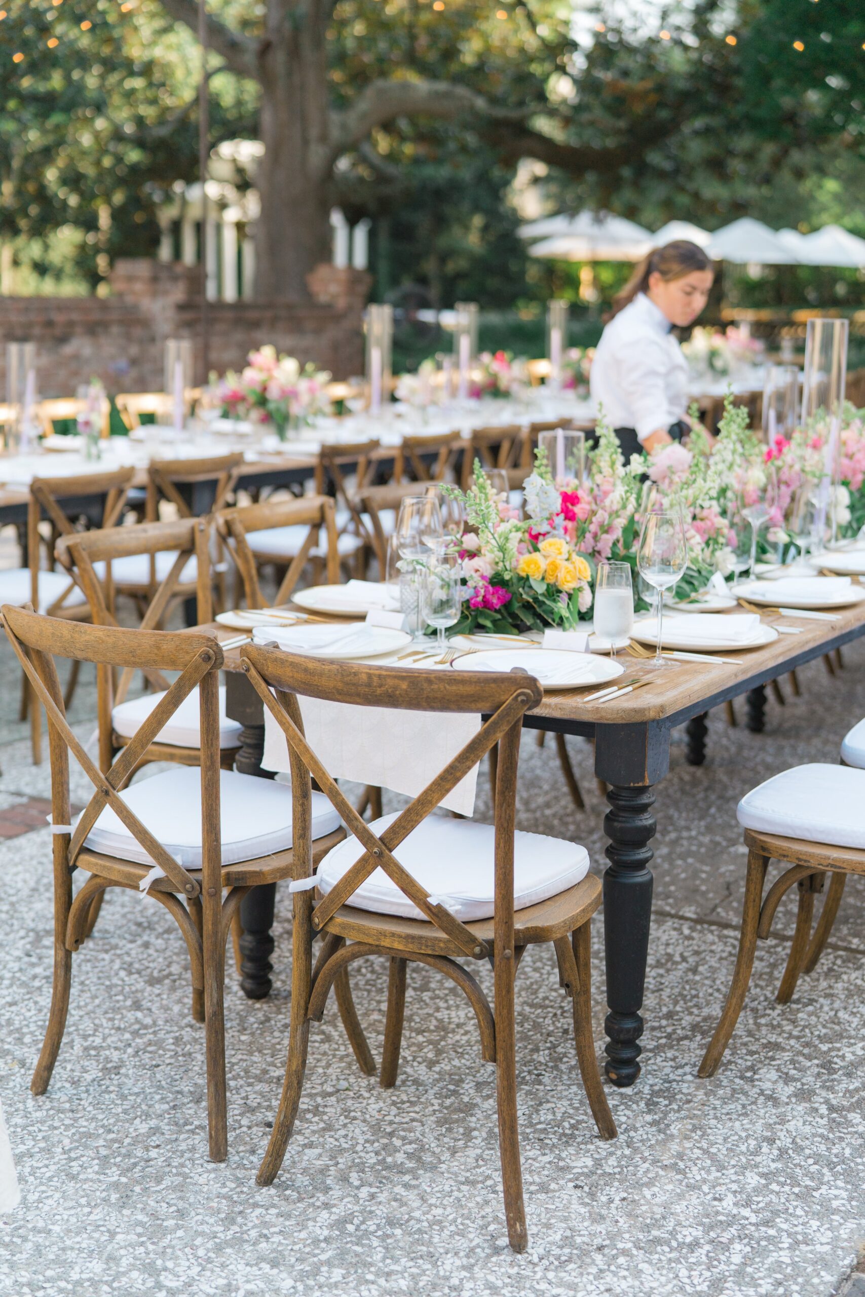 long tables at outdoor wedding reception in Charleston