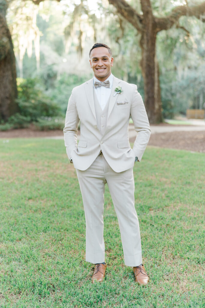 Charleston groom wearing tan suit and bow tie.