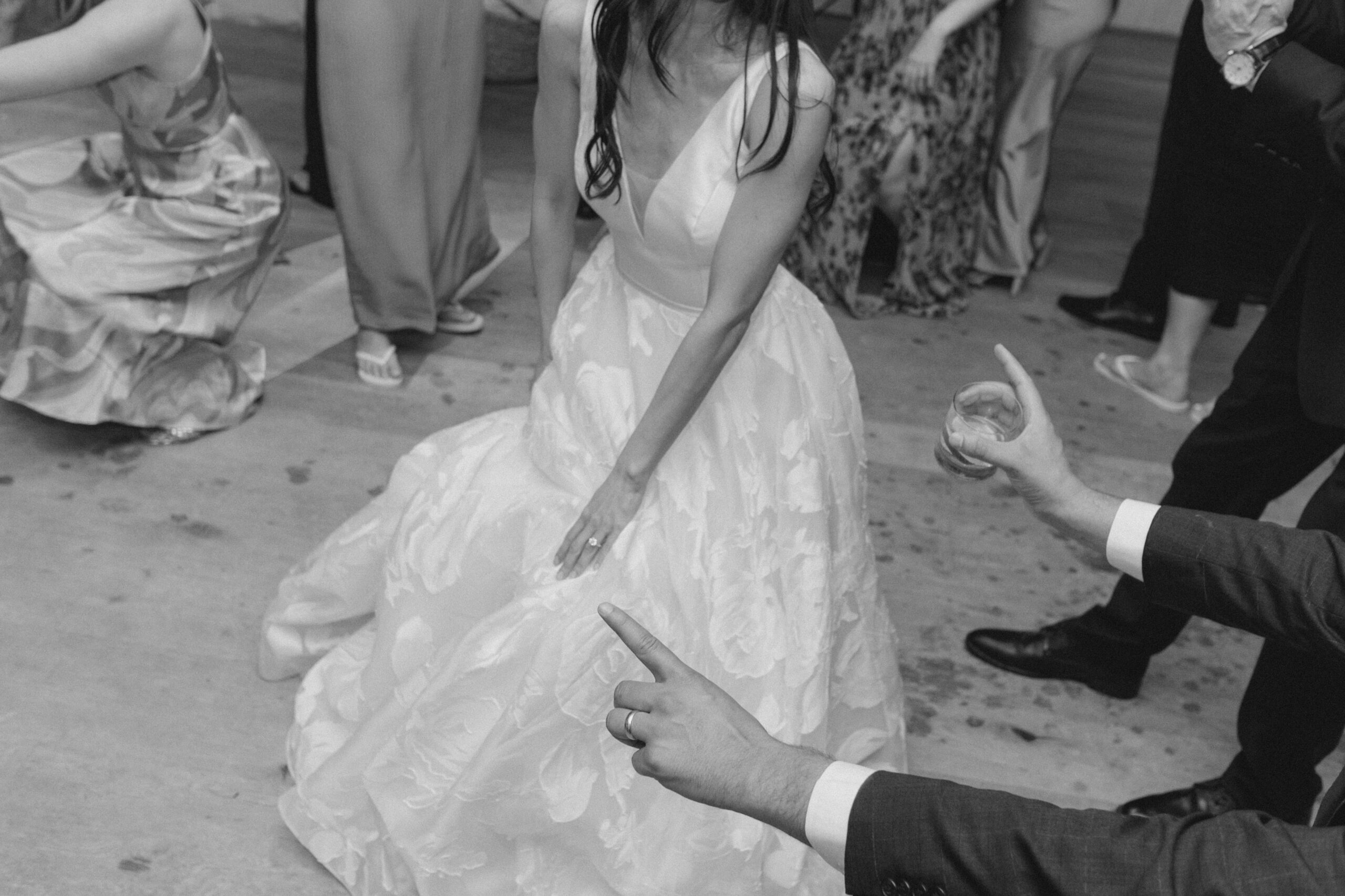Bride hits the dance floor. Black and white reception photos.