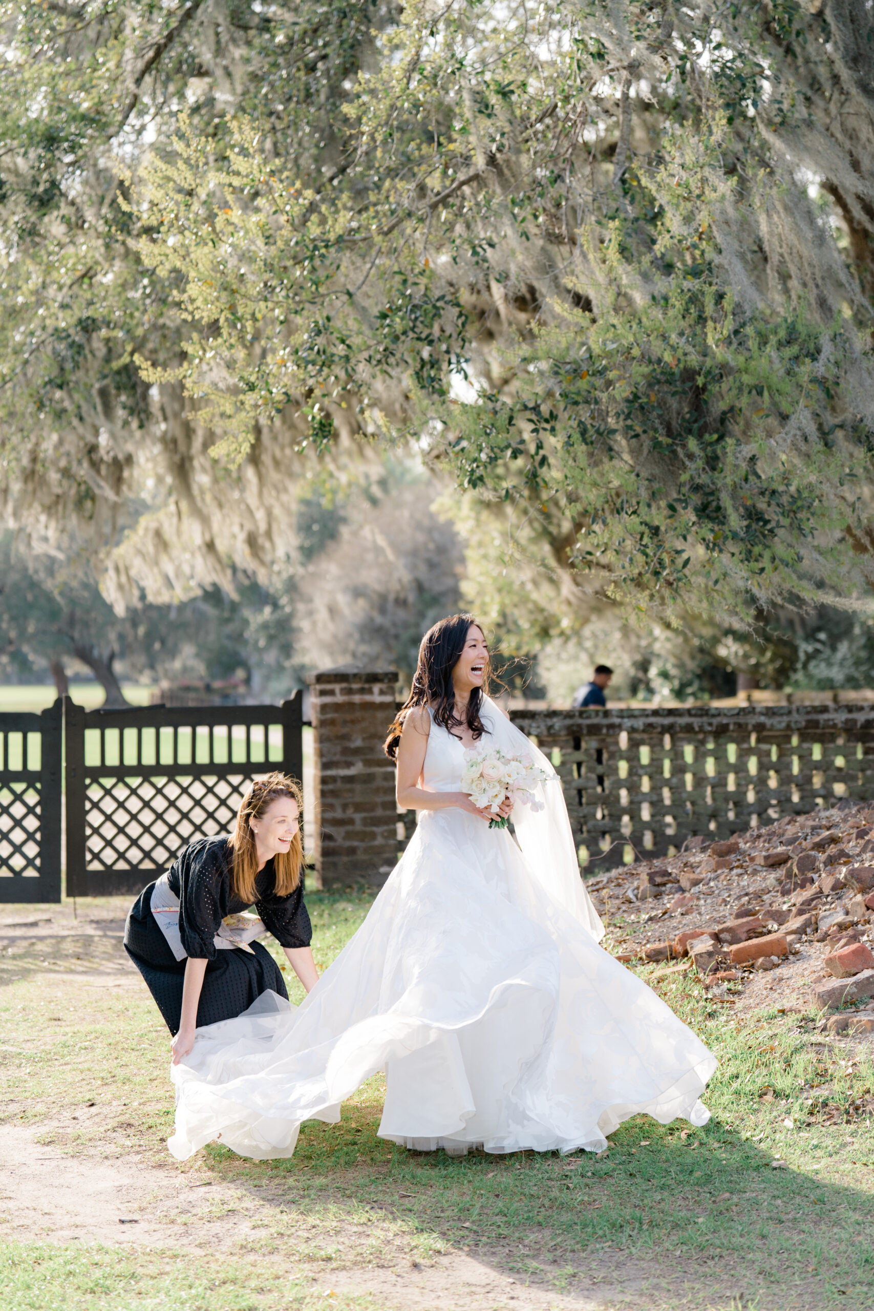 Bride arrives to wedding ceremony. Golden sunshine and spanish moss. Wedding photographer that catches all the in-between moments.