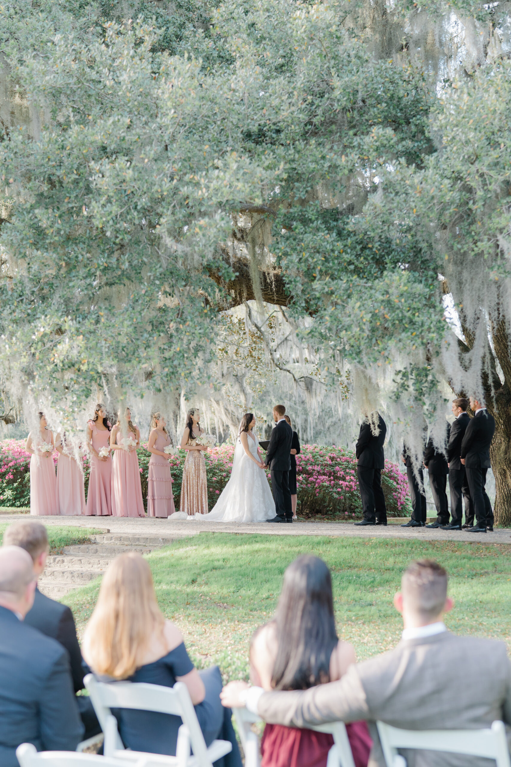 Wedding ceremony under big oak tree with spanish moss. Middleton Place spring wedding. 