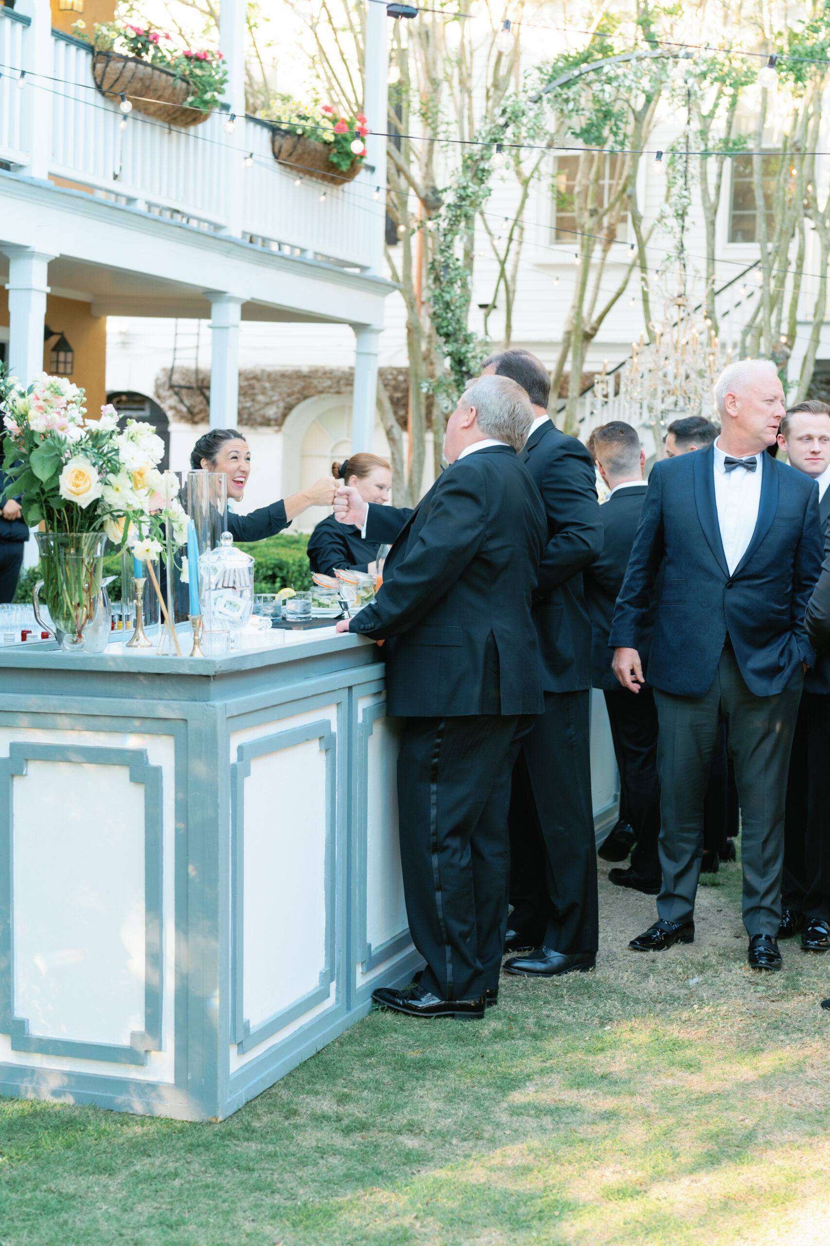 Wedding guests interact with bartenders.