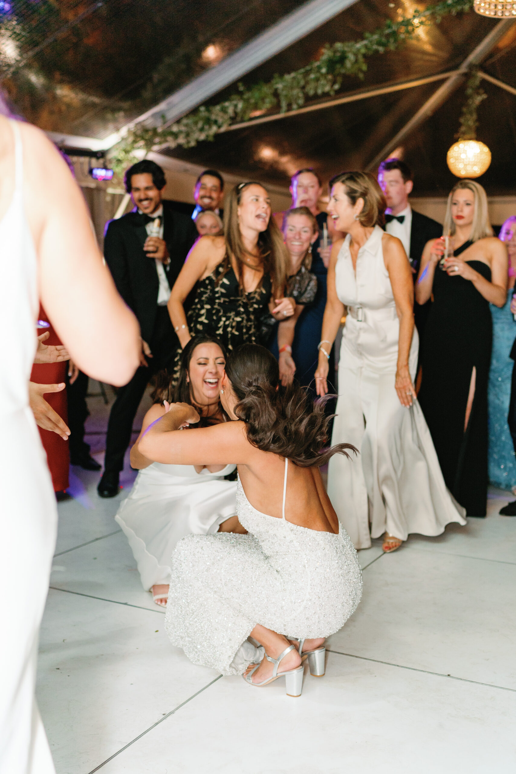 Bride dances with her best friend.