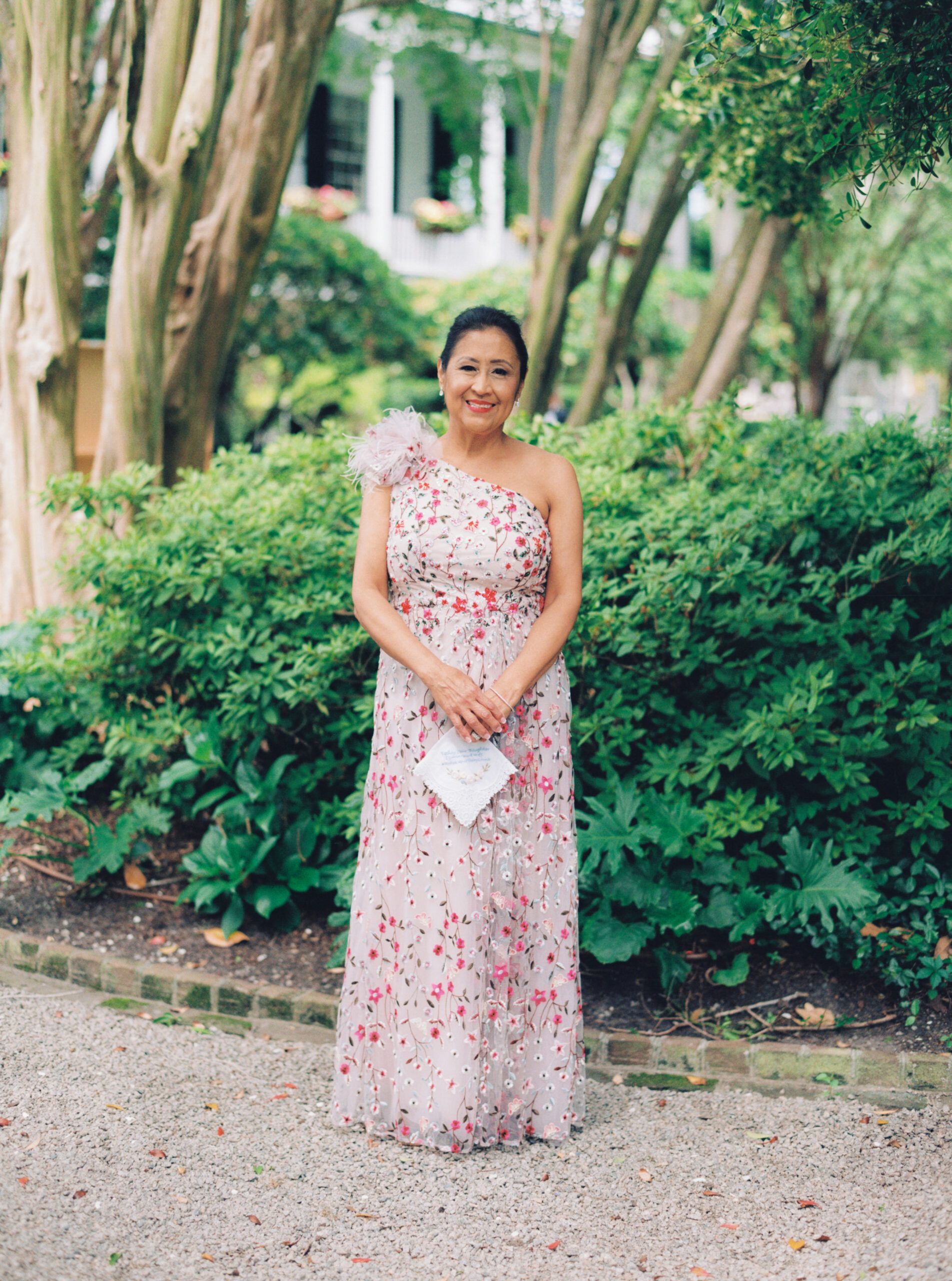 Mother of the bride in pink dress with floral pattern
