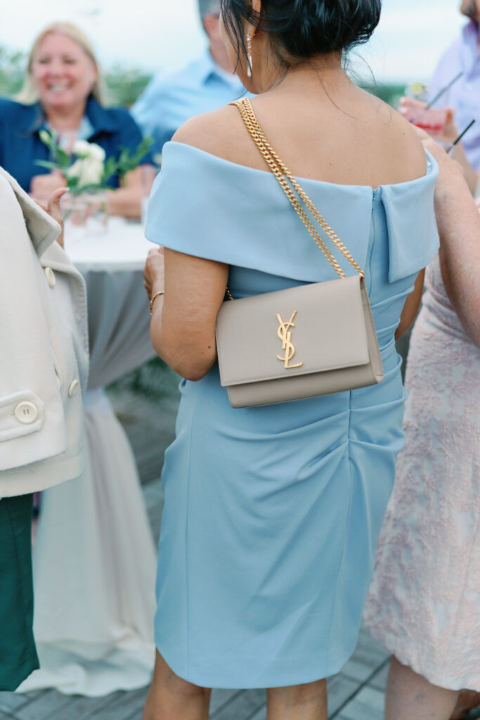 Mother of the bride dress and purse. Wedding welcome party. YSL purse.