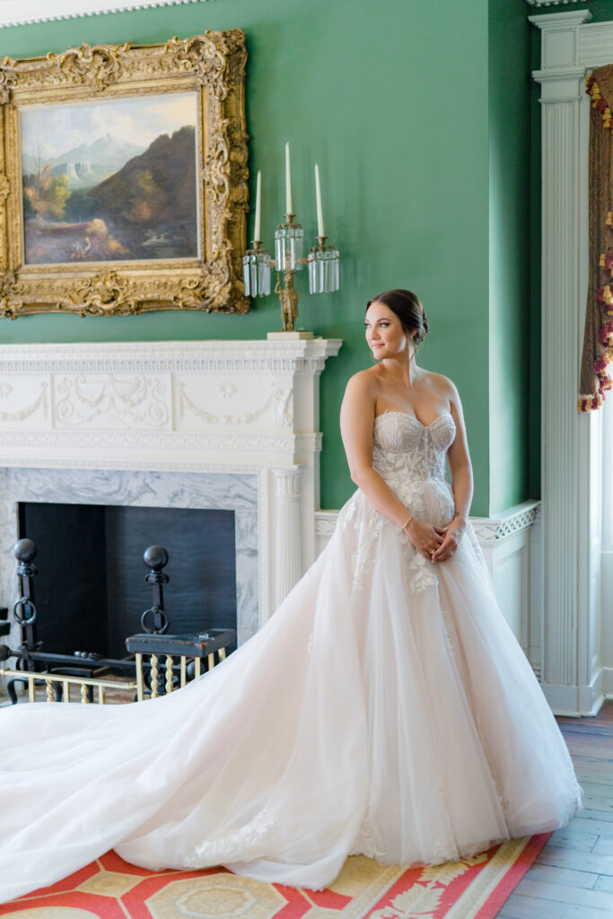 Bridal portrait in the green room downstairs at William Aiken House. Bride in sleeveless wedding dress. 