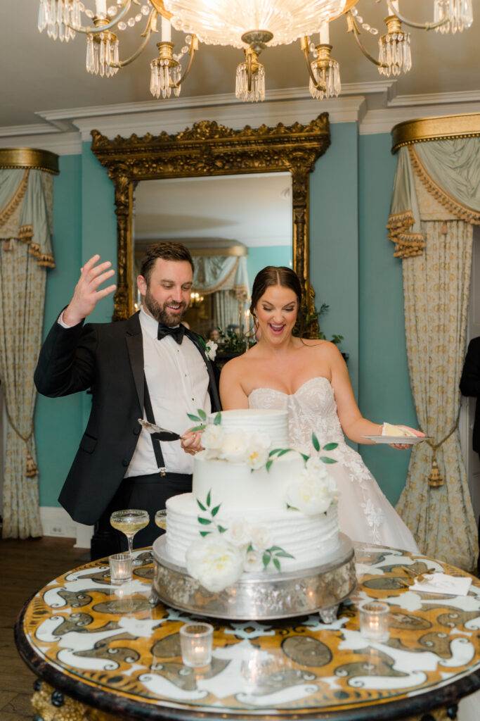 Bride and groom cut the cake in the downstairs ballroom of William Aiken House where the notebook was filmed. 