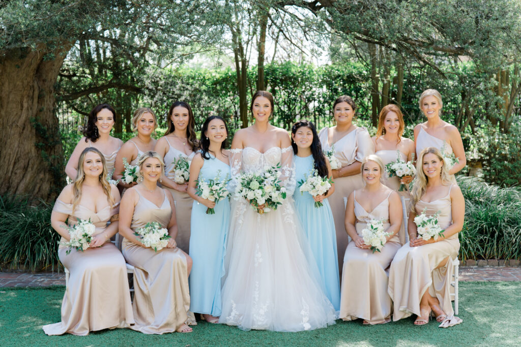 Bride with bridesmaids. Junior bridesmaids in light blue dresses.