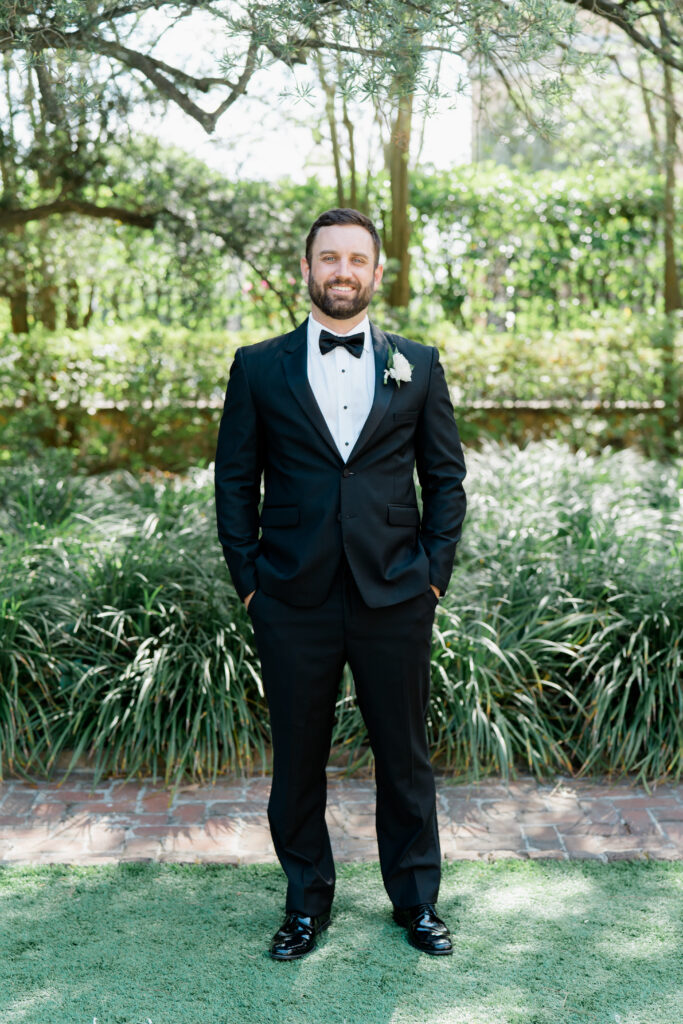 Charleston groom in black tuxedo. 
