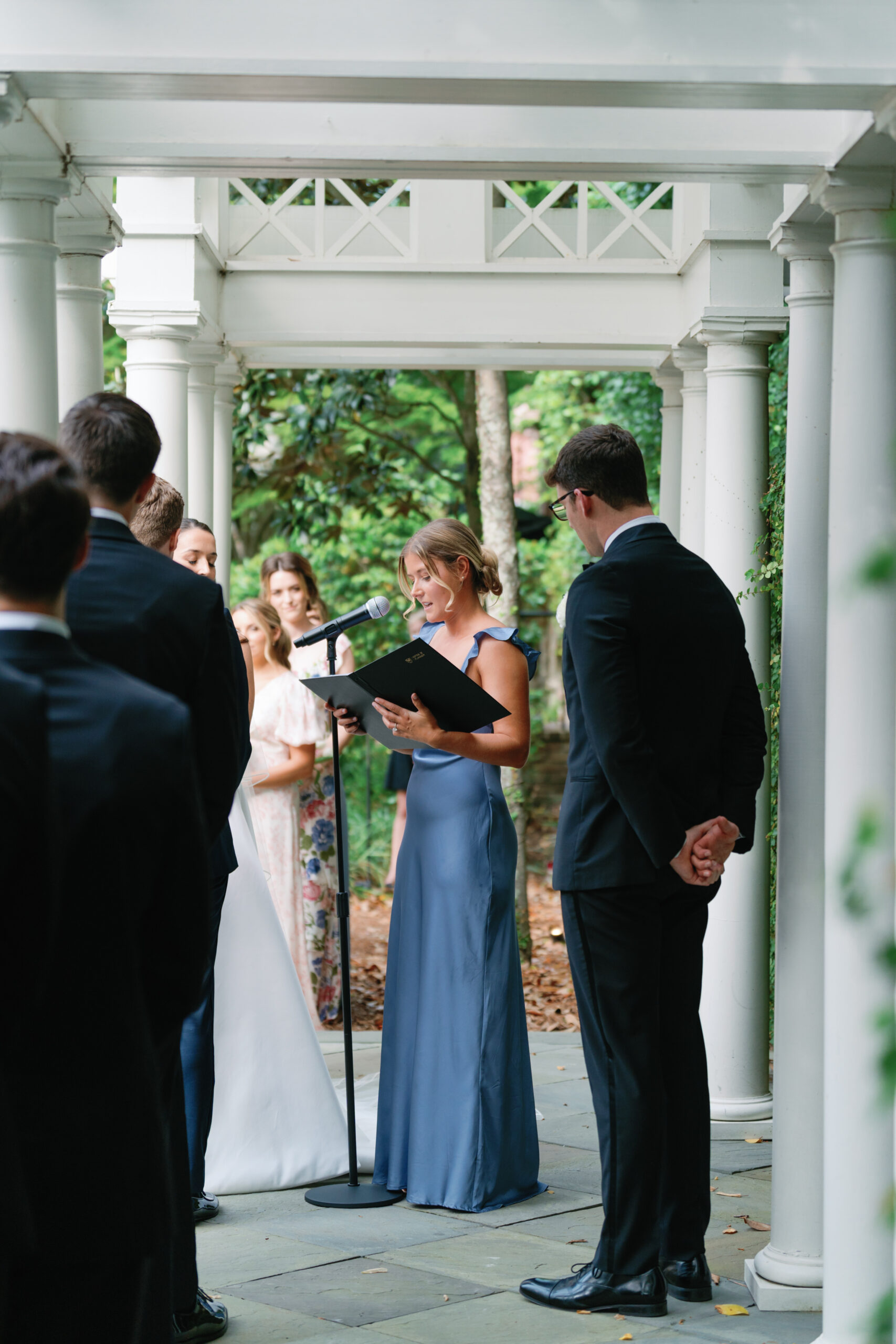 Reading by bridesmaid during wedding ceremony. 