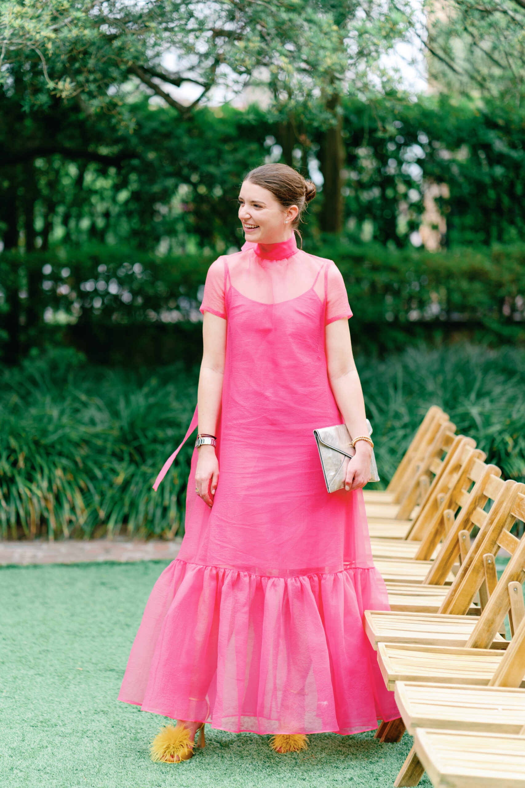 Wedding guest pink sheer dress with fluffy yellow heels. 
