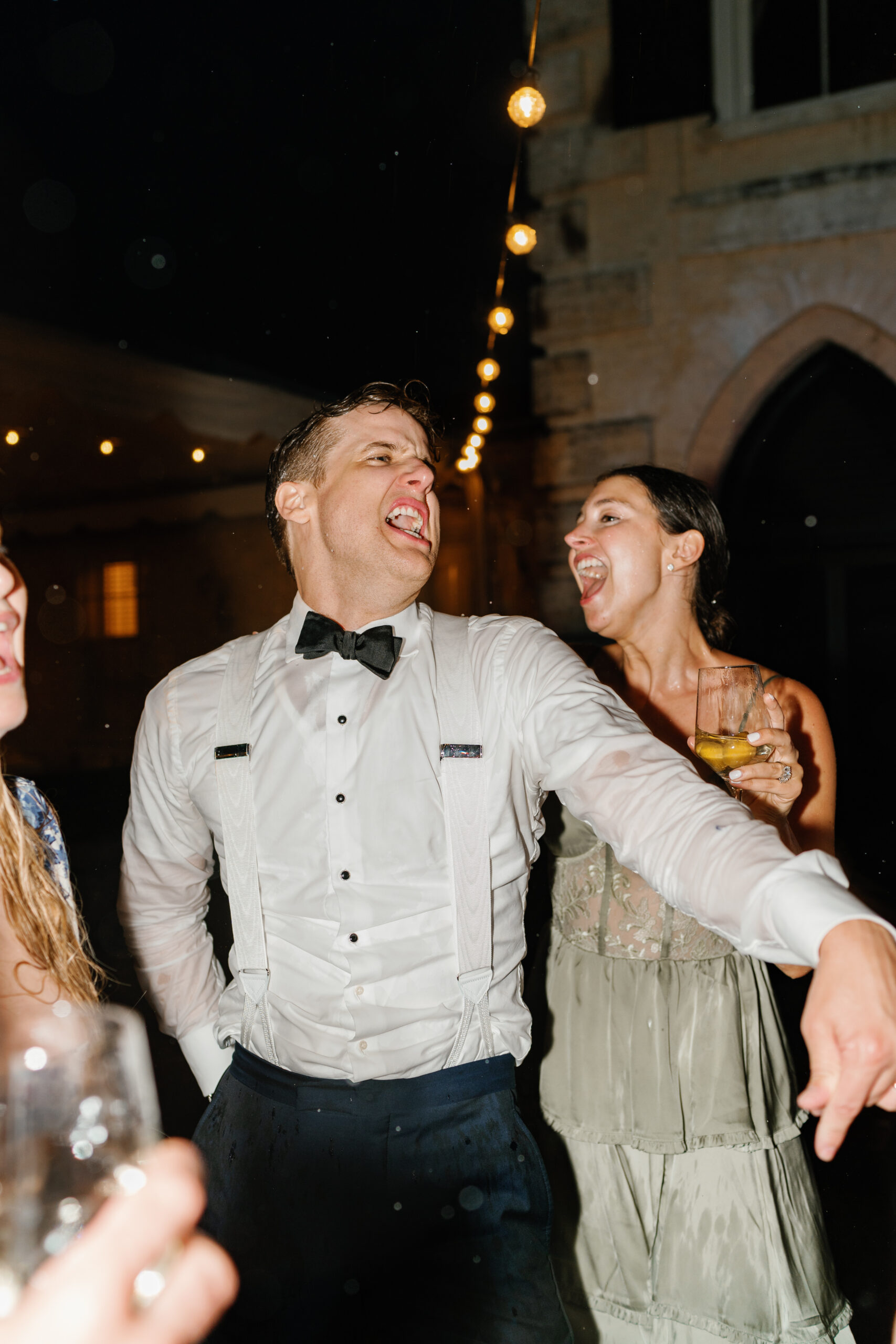 Groom belts out a song on the dance floor. 