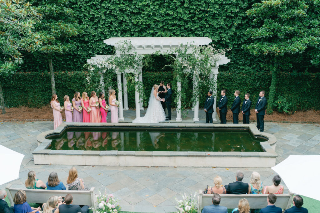 Wedding ceremony at William Aiken House arbor. Charleston wedding photography