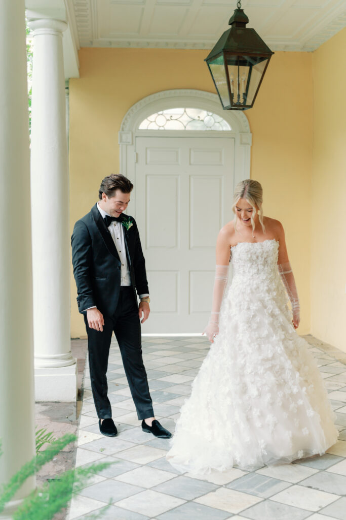 Groom sees bride in wedding dress for the first time on wedding day. photographers in charleston. 