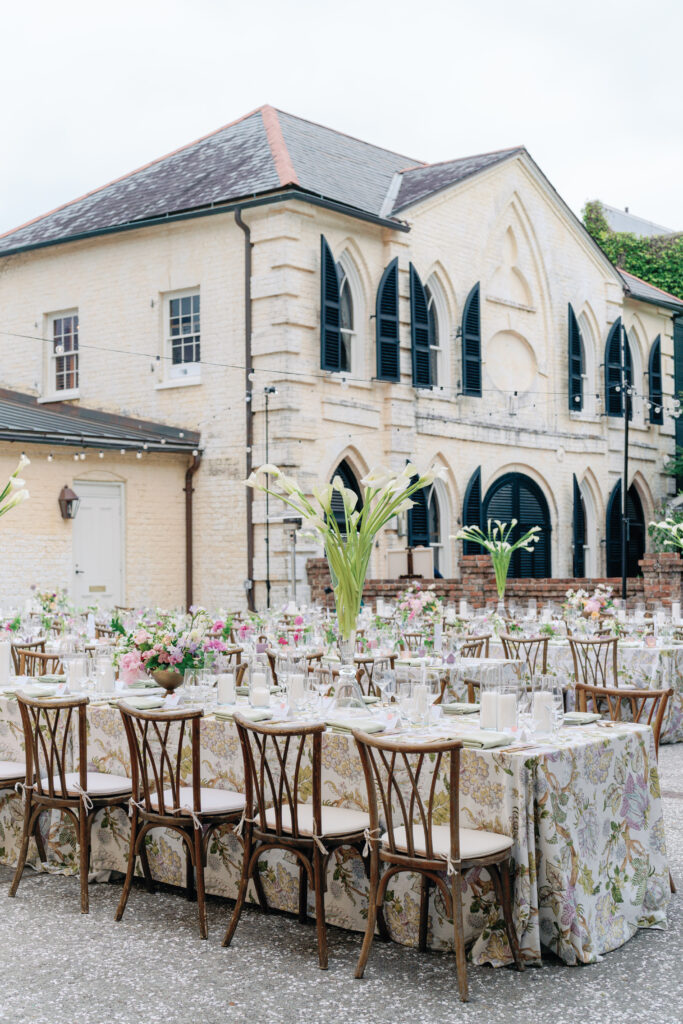 Open-air wedding reception dinner in the oyster tabby at William Aiken House. 
